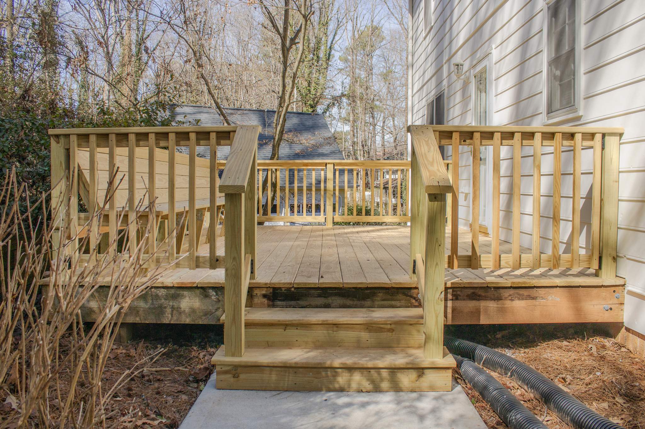 Deck Resurface with Wood Bench Install Using Pressure Treated Pine by Nelson Exteriors 