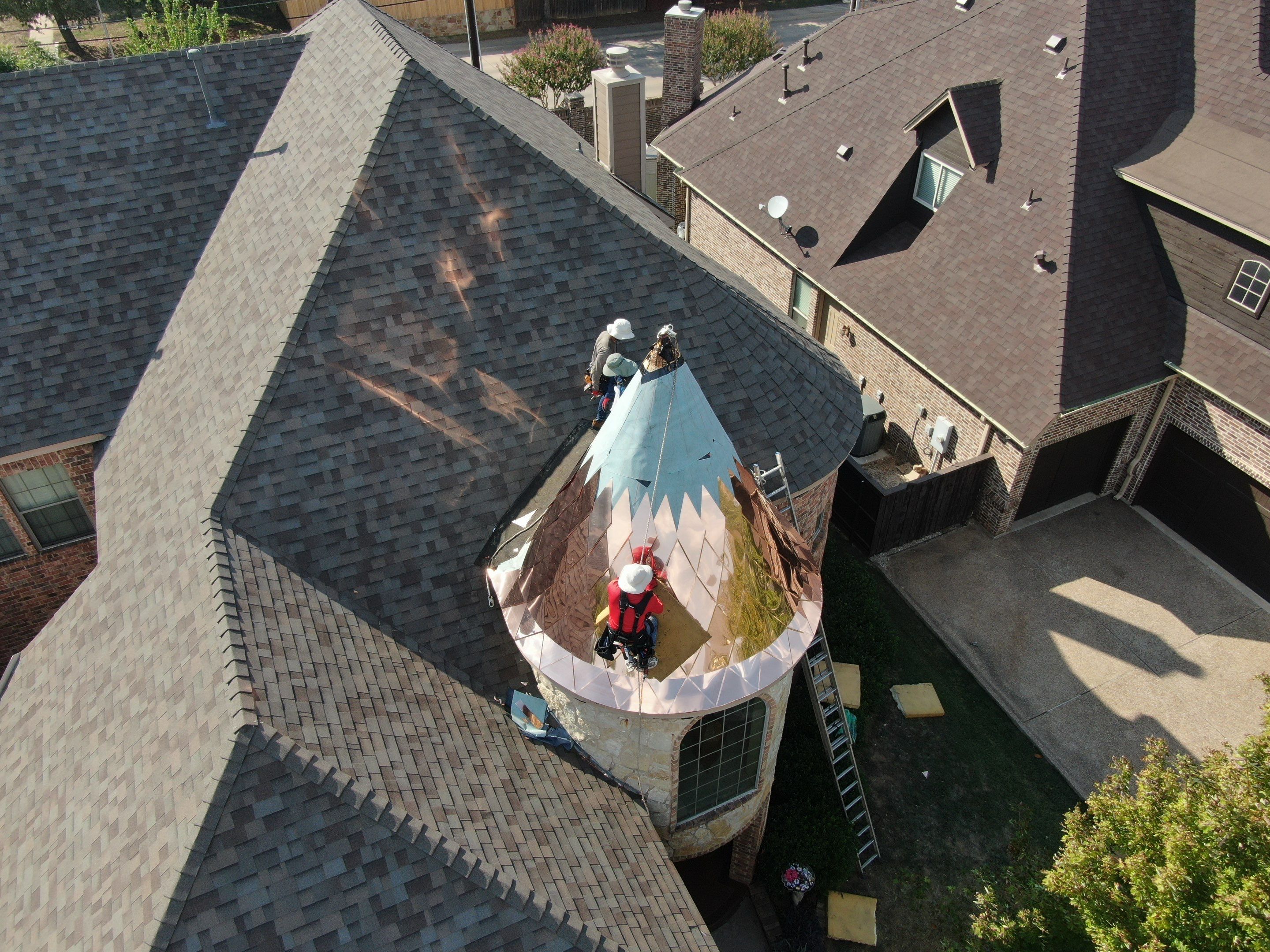 Installing Custom copper turret and Malarkey Vista Class 4 shingles Hail Damage Upgrade by Becker Roofing and Exteriors