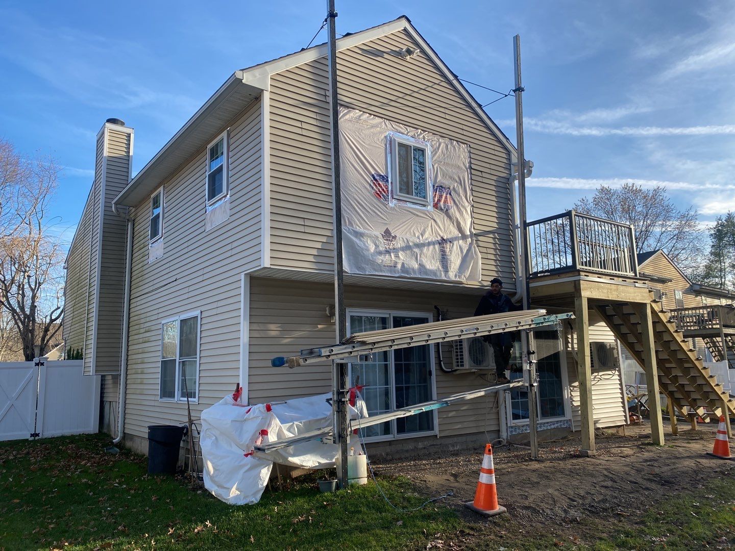 Siding Repair using Certainteed Mainsteet D4 and EPDM roof under deck by A Plus Exterior