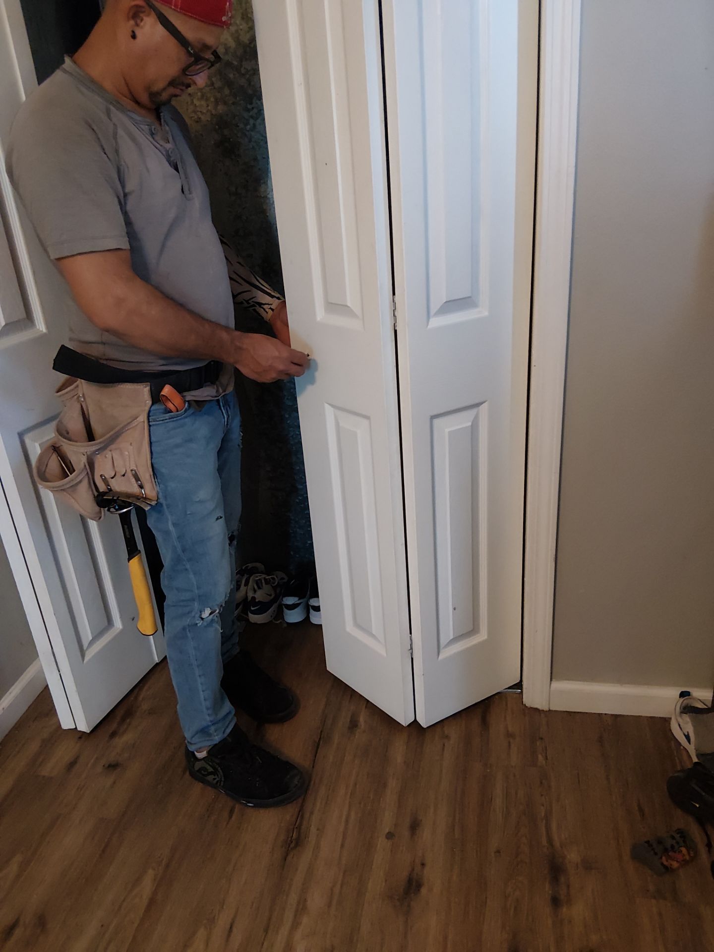 White Paneled Bifold Closet Door Installation by Legendary Services Company LLC.