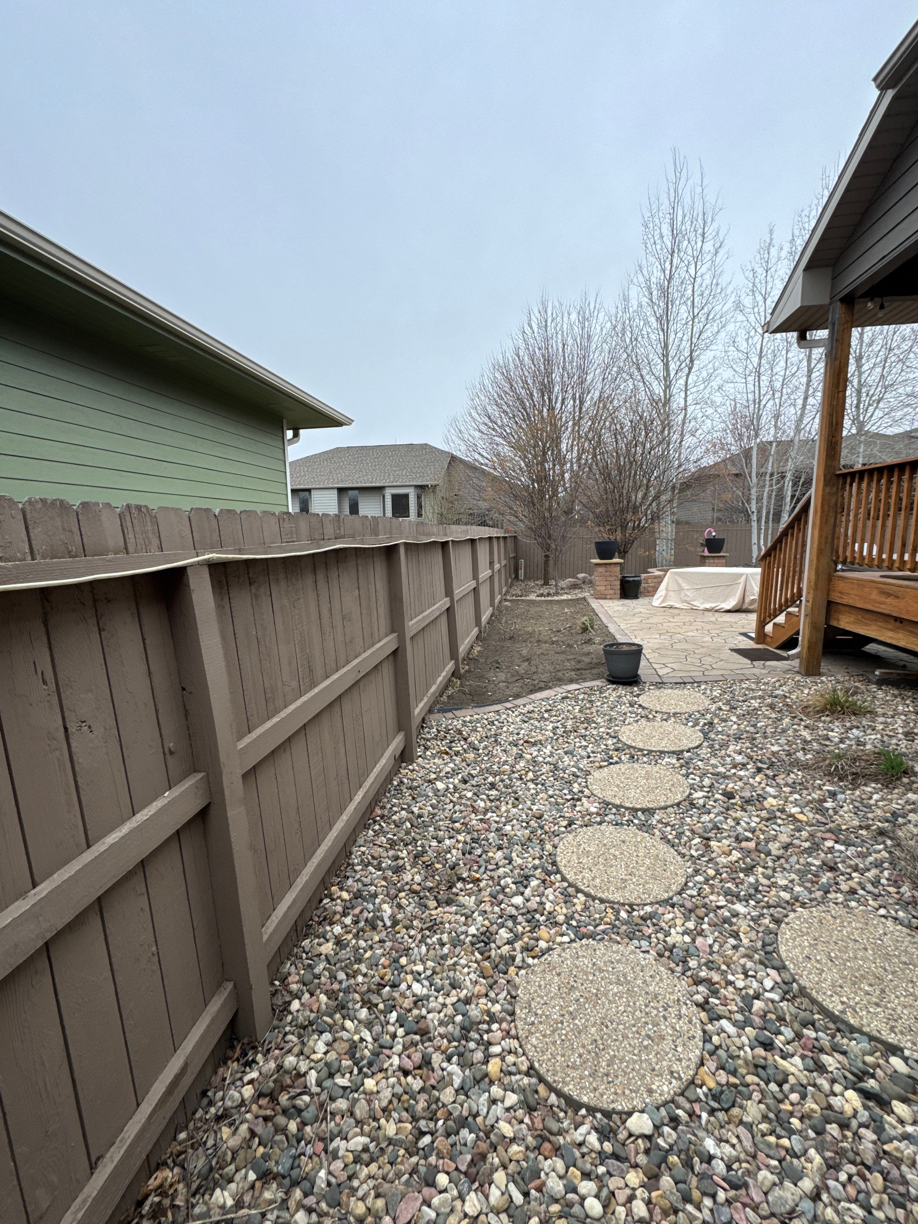 Sioux Falls Residential Exterior Update and Flagstone Pool Deck by Select Painting, Coatings & Garage Cabinets