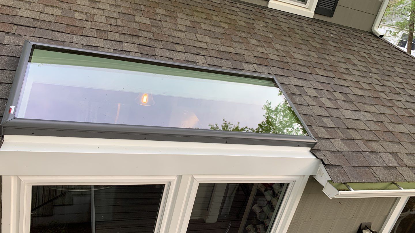 Skylight and Gutter Replacement by American Home Contractors