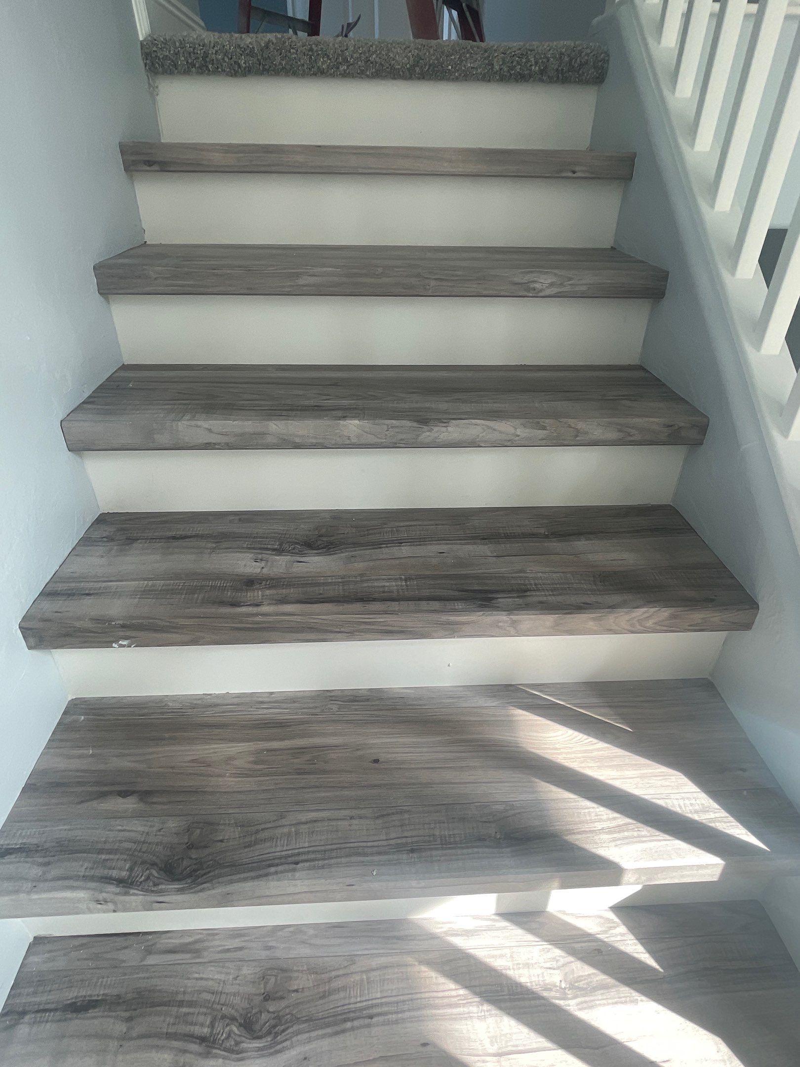 Laminate Staircase and Flooring  by Footprints Floors of Chandler 