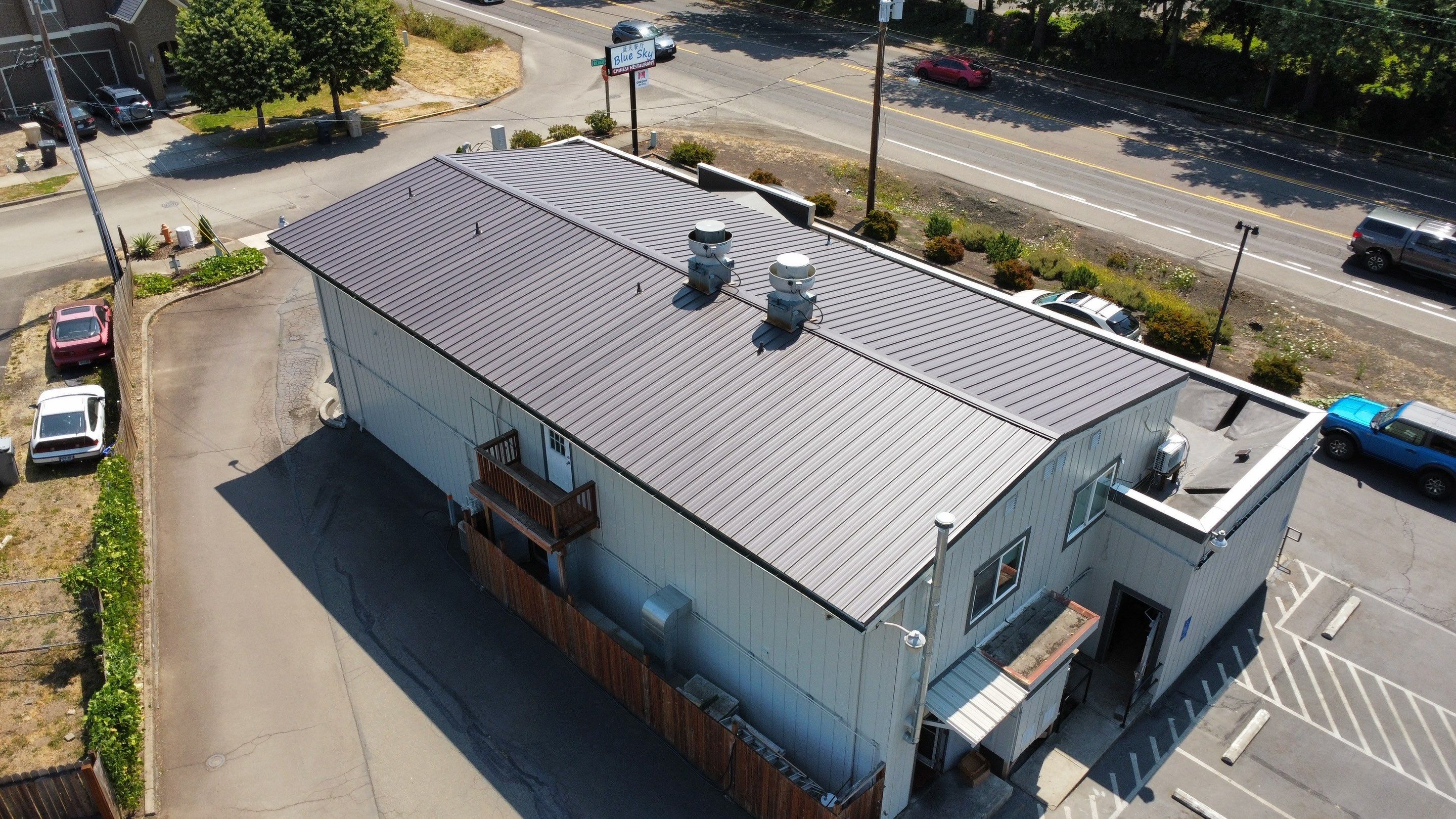 Commercial Flat Roof Installation using Bruce and Dana Snap Lock Metal (Color: Brown) by Orezona Building & Roofing Company, Inc.