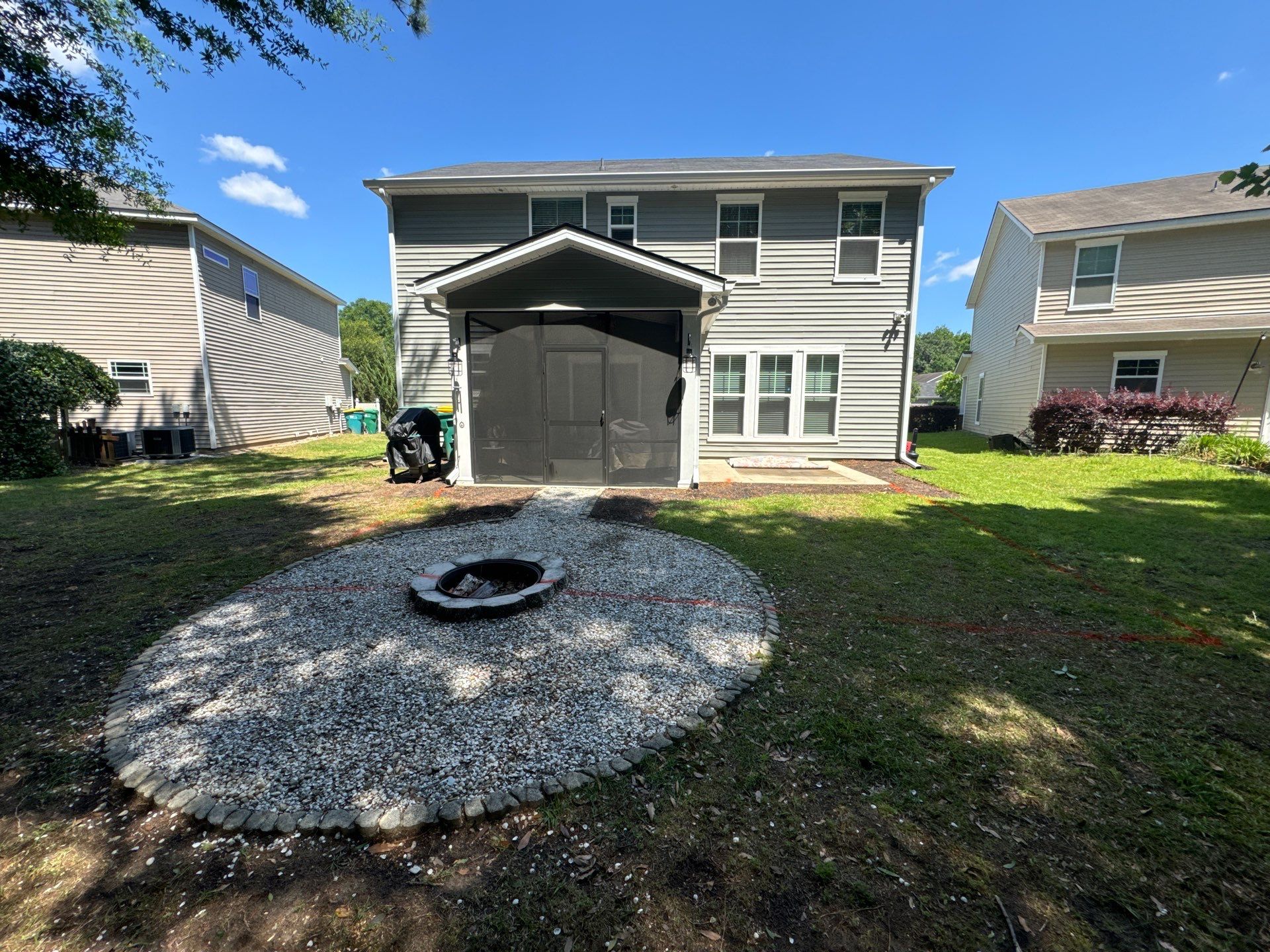Custom Paver Patio Extension and Circular Fire Pit in Bluffton by Lowcountry Scapes, LLC