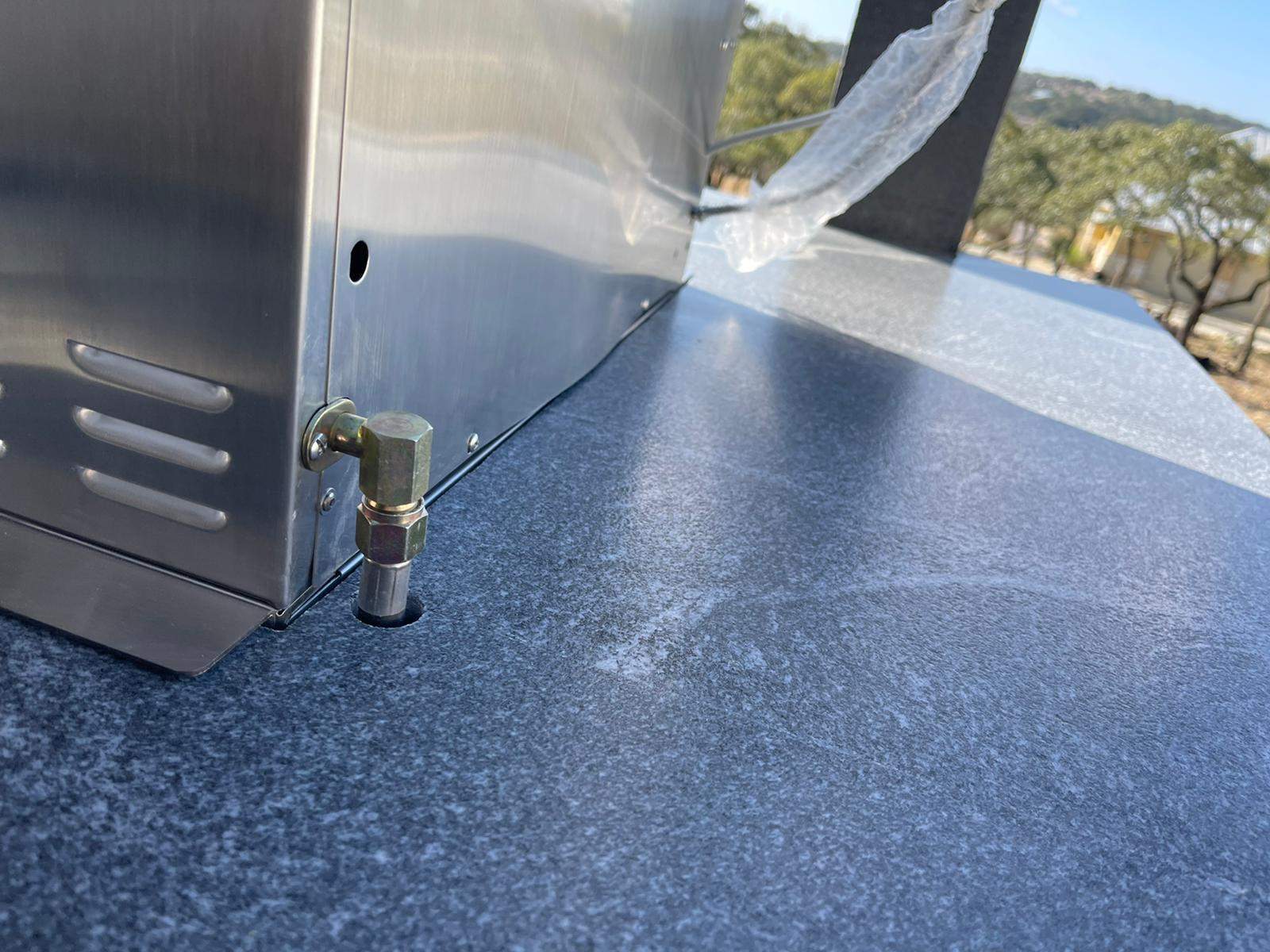 Outdoor kitchen using Black mist honed granite by Mena stone surfaces