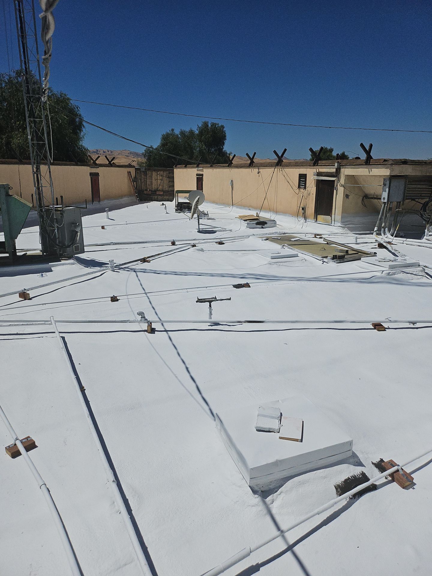 Spray foam and coatings using General Coatings acrylic coatings and spray foam by Straight Edge Roofing Inc