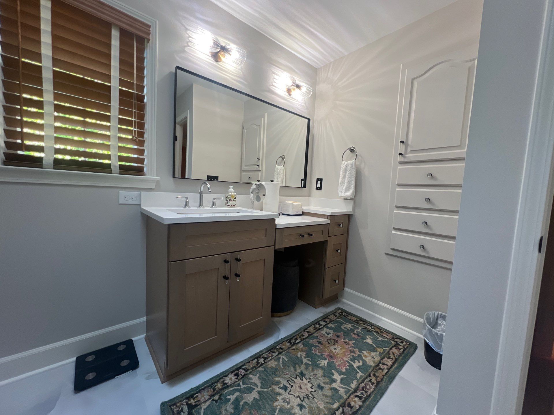 Modern Bathroom Remodeling Featuring Marble Tiles and Custom Cabinetry in Smyrna by Swift Home Renovations