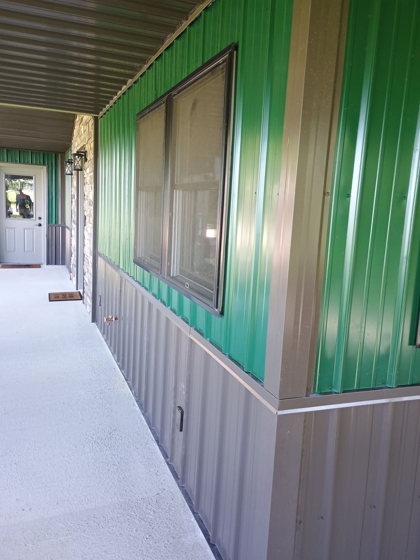 Siding Installation using Platinum AG Panel Burnished Slate  by Nitro Roofing and Construction