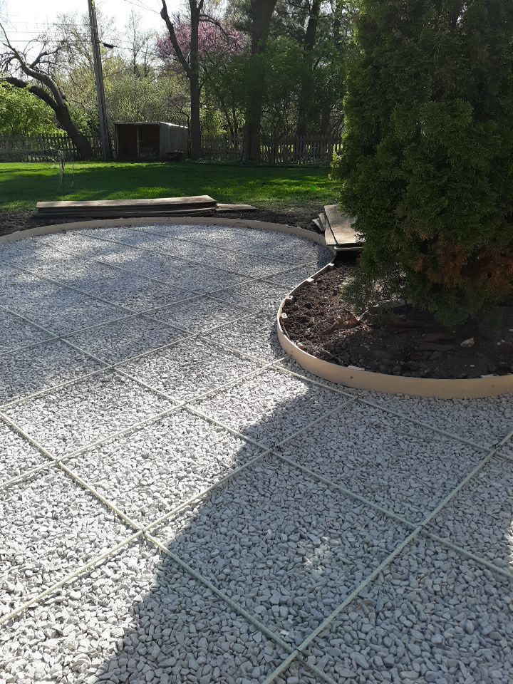 Back Yard Stamped Patio by LAND ESCAPES LLC