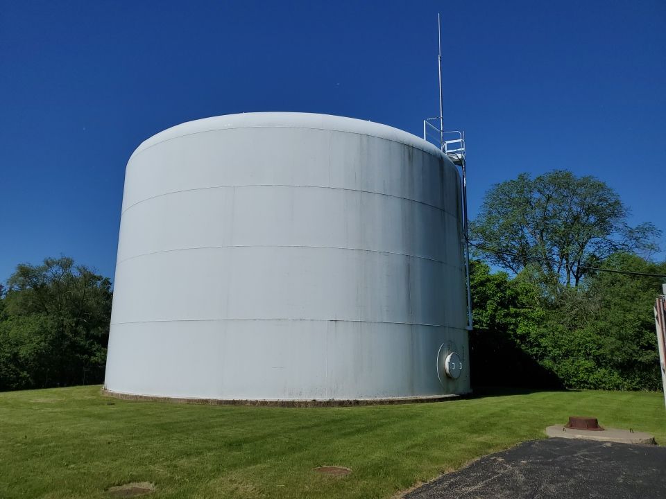 Water tank cleaning by Northern Power Washing LLC.