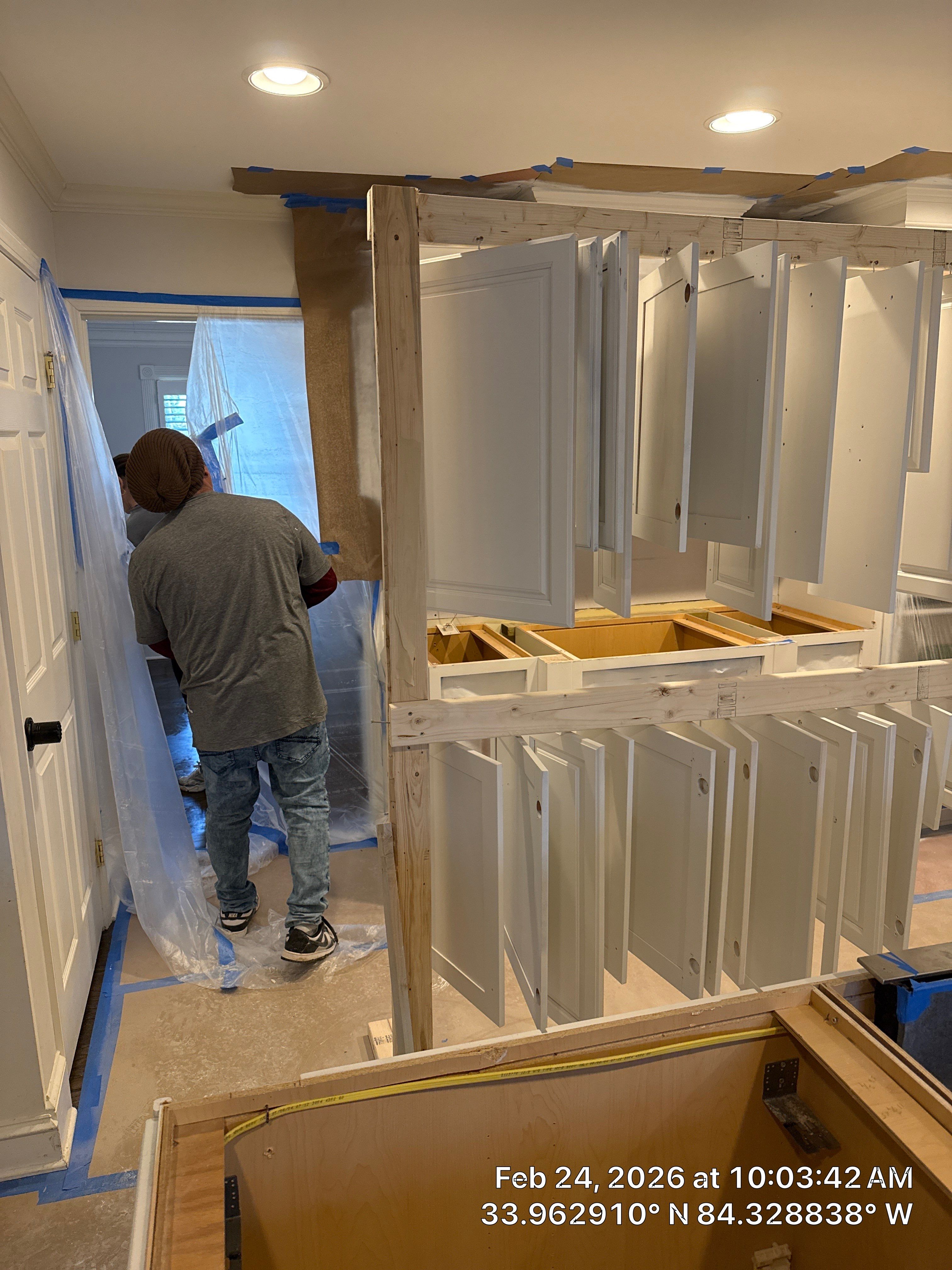 Kitchen Remodel in Dunwoody Featuring White Cabinetry and Blue Island by Heart & Home Kitchen & Bath Remodeling LLC