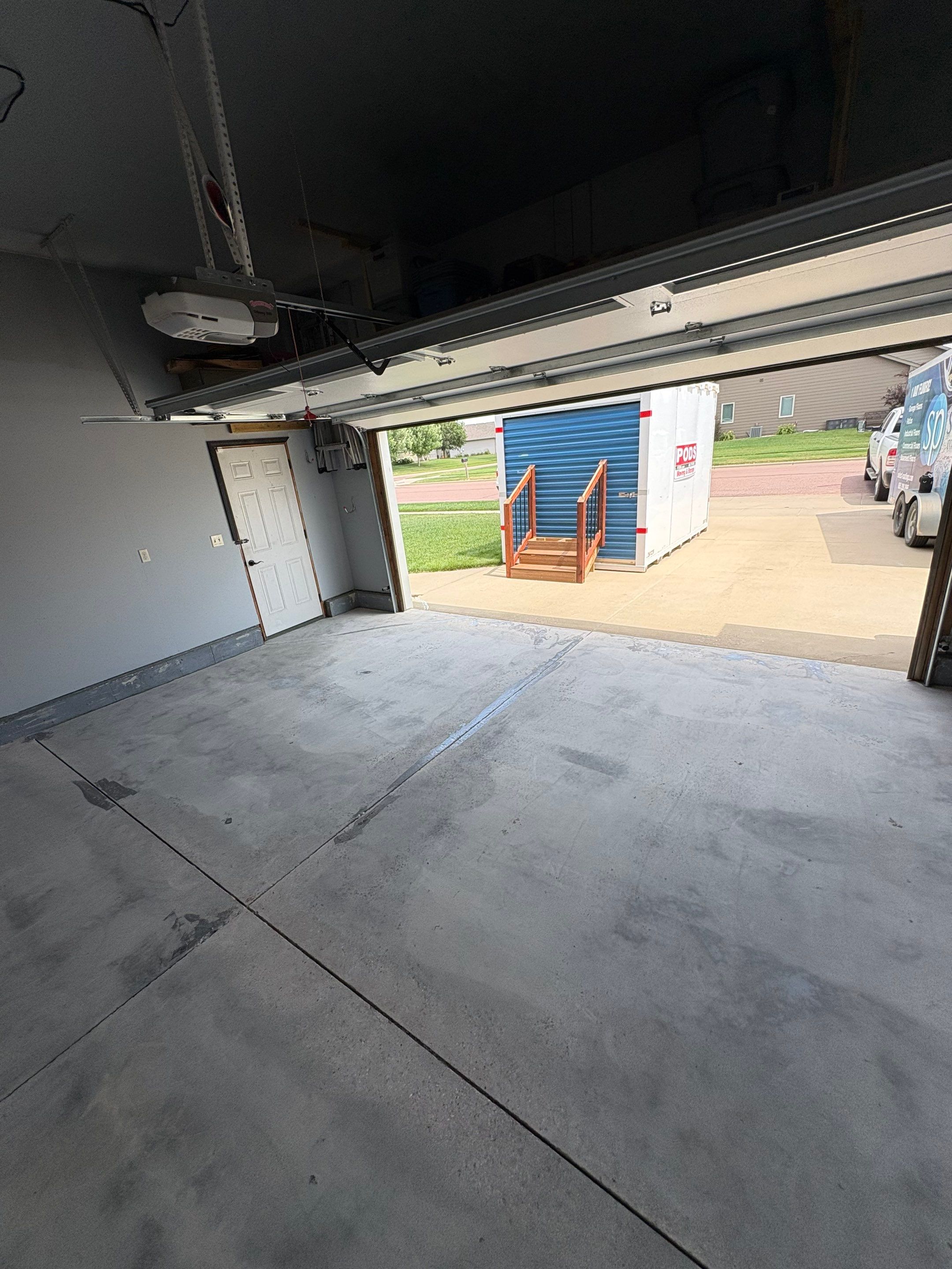 Sioux Falls Garage Concrete Coating Installation with Domino Flake by Select Painting, Coatings & Garage Cabinets