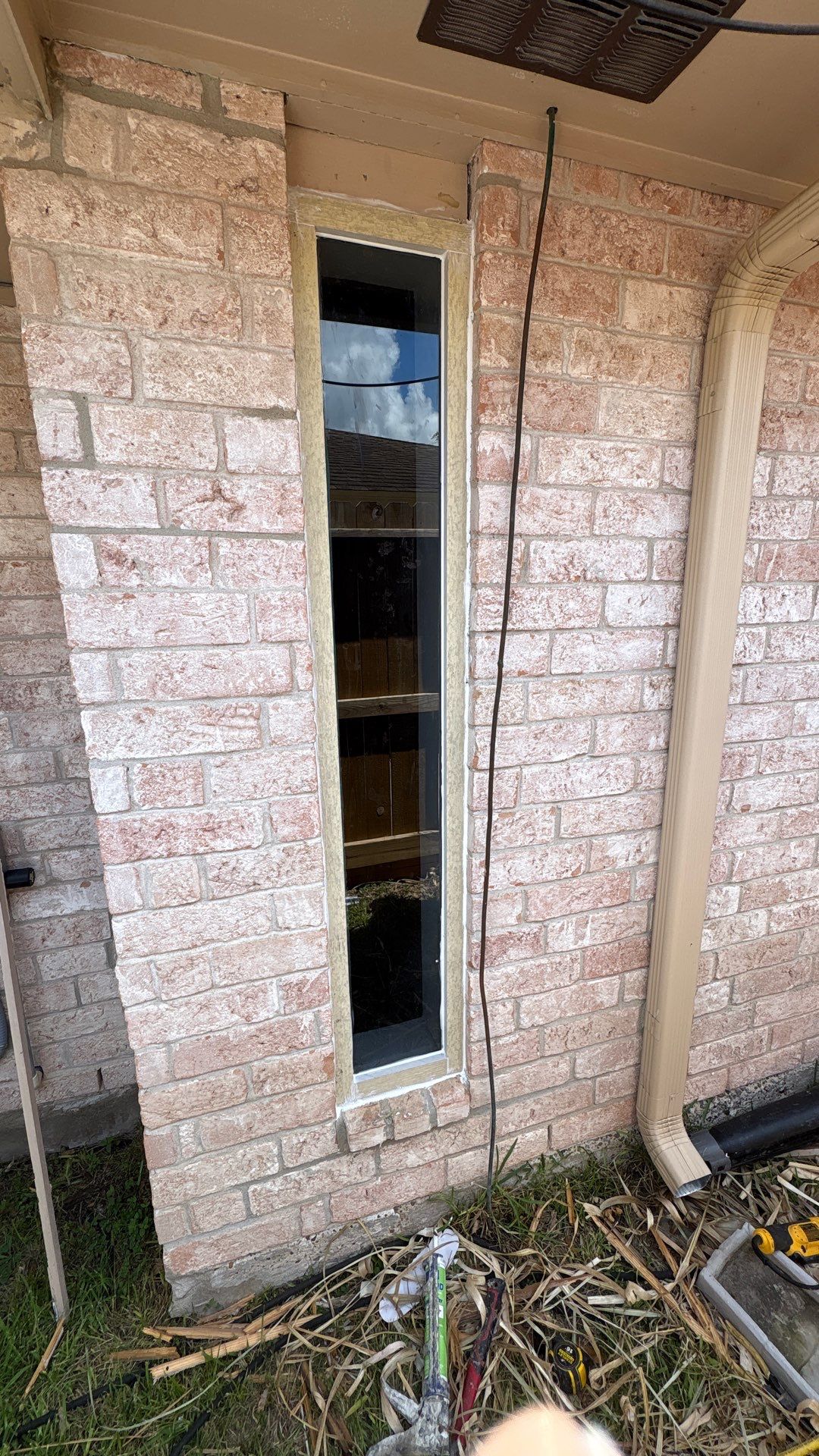 Colored Vinyl Windows to blend into brick by Bayfront Roofing and Construction