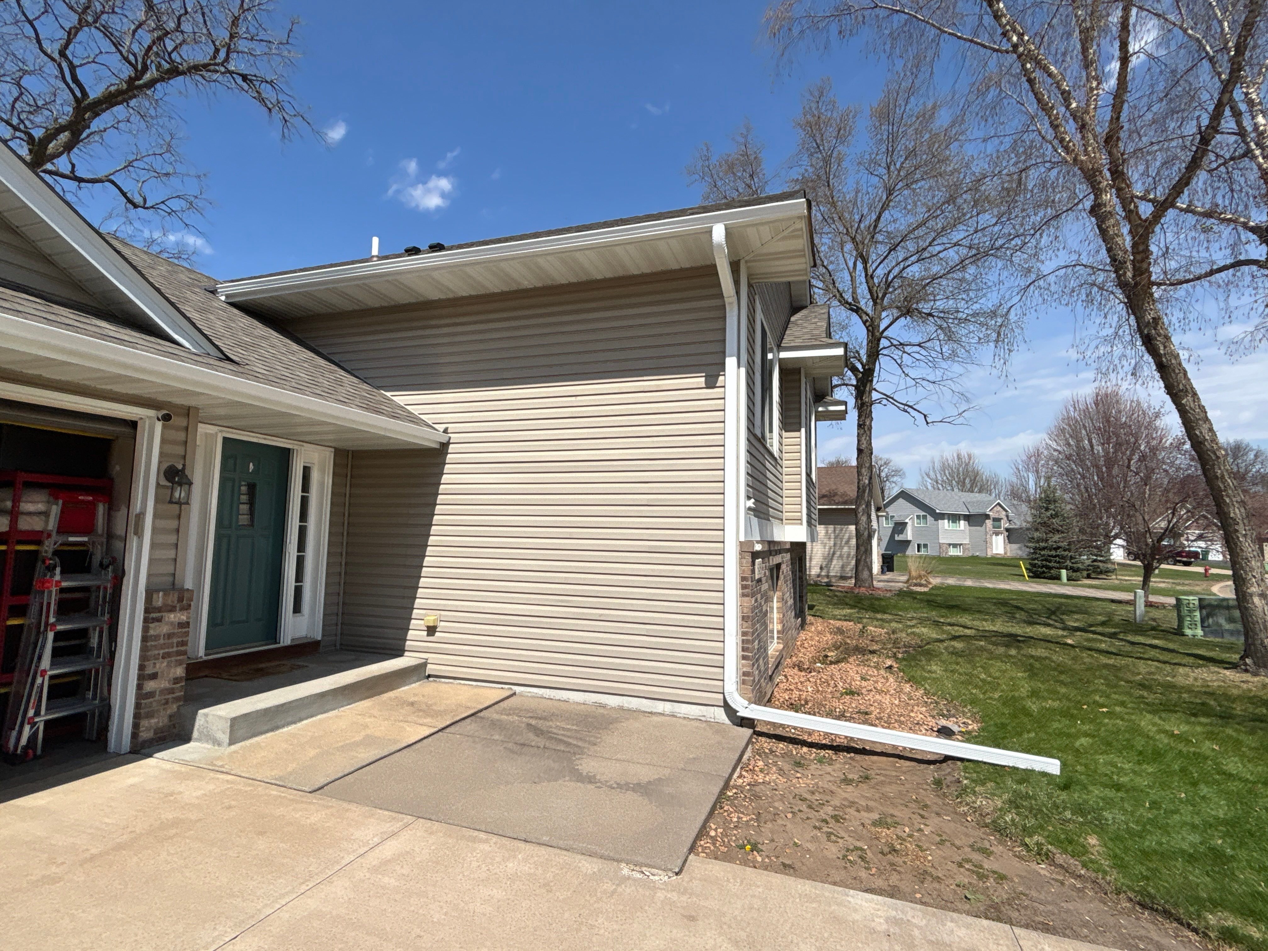 Seamless Gutter Installation in Big Lake MN | 5” White Gutters & LeafBlaster Pro Gutter Guards by Next Level Seamless Gutters / Exteriors Inc.