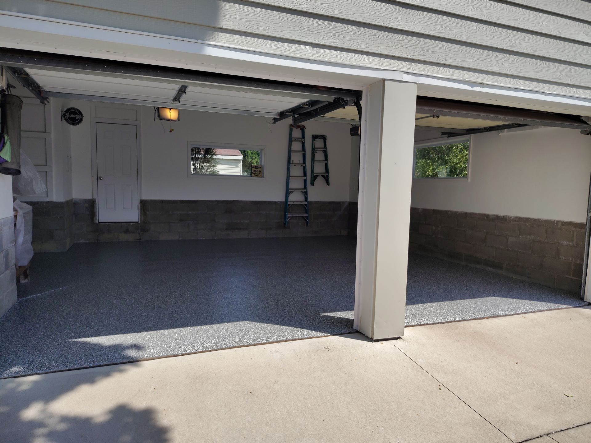 Wombat Flake Garage Floor Coating in Perry, IA by Revival Concrete Coatings