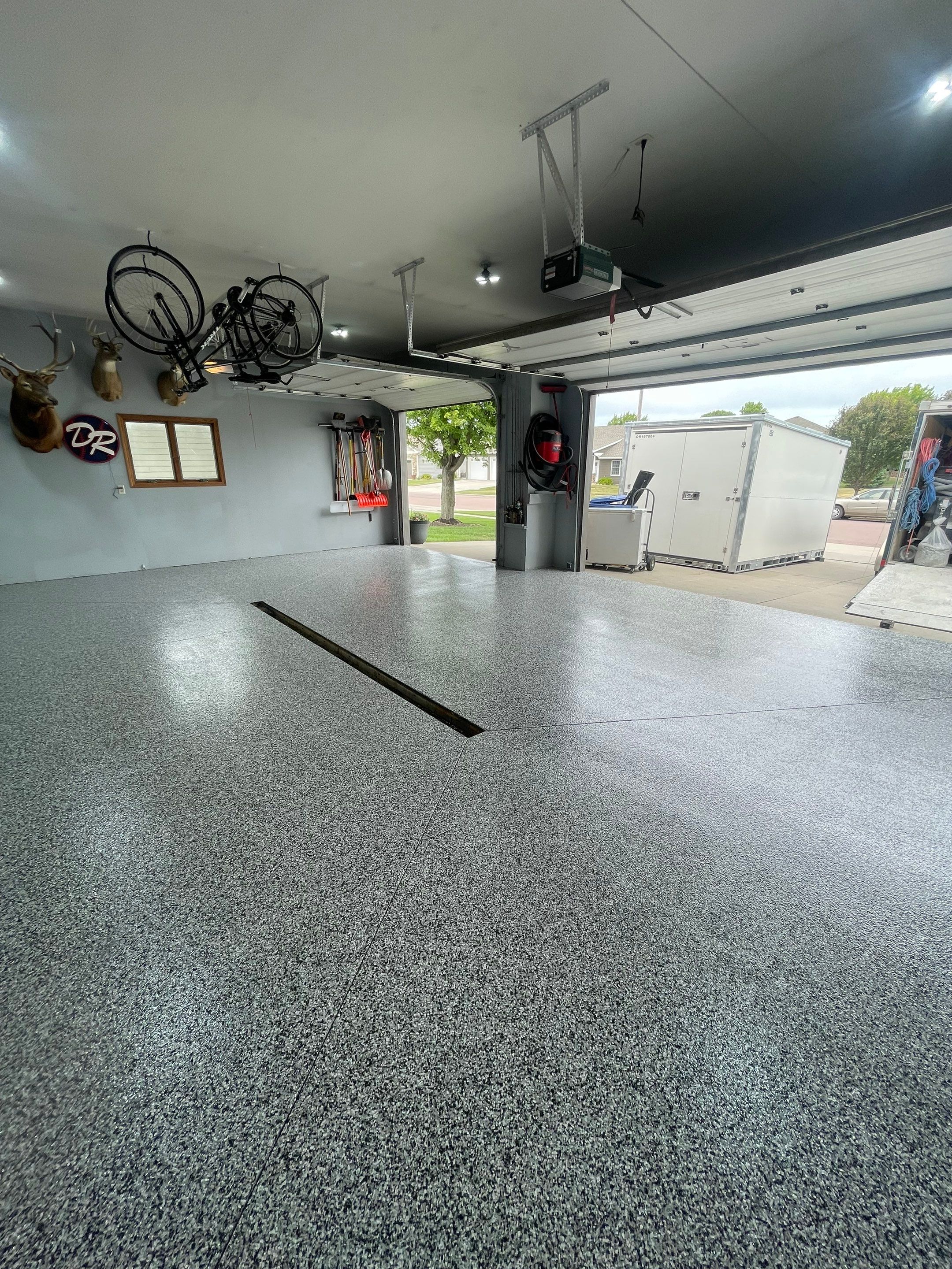Full Garage Floor Epoxy Coating Installation in Dell Rapids by Select Painting, Coatings & Garage Cabinets