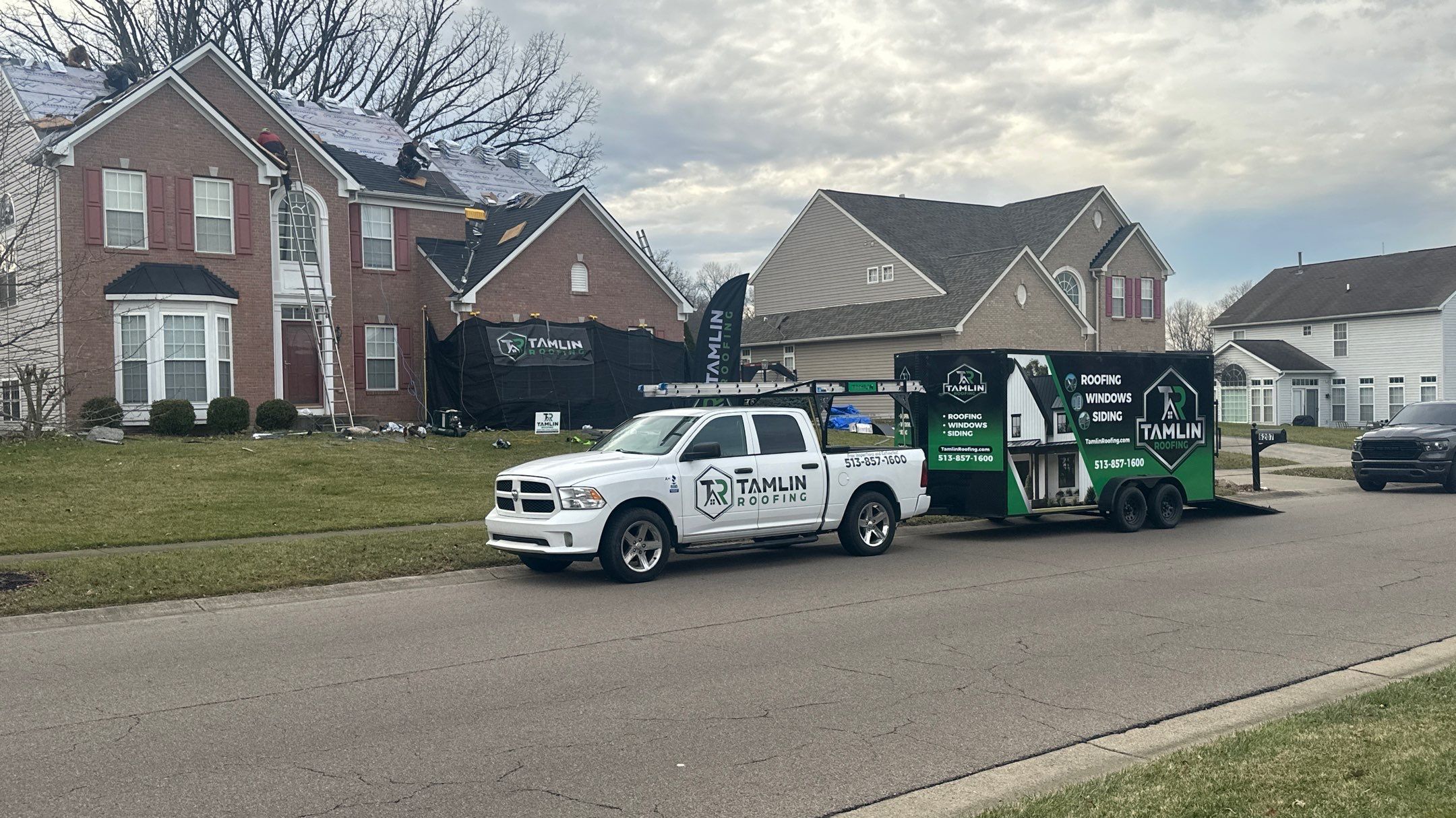 Walden Ponds - Pristine Black and Hydro Flo Gutter Guards by Tamlin Roofing
