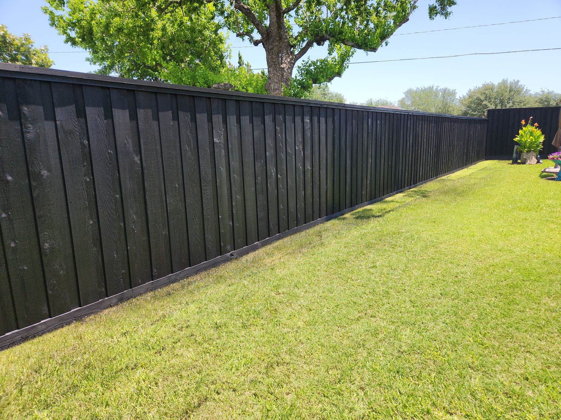 Modern Black Fence Finish by Tim's Fences