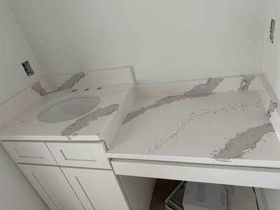 Kitchen and Bathroom Countertop Upgrades Featuring Gray Veined Quartz by Mena stone surfaces