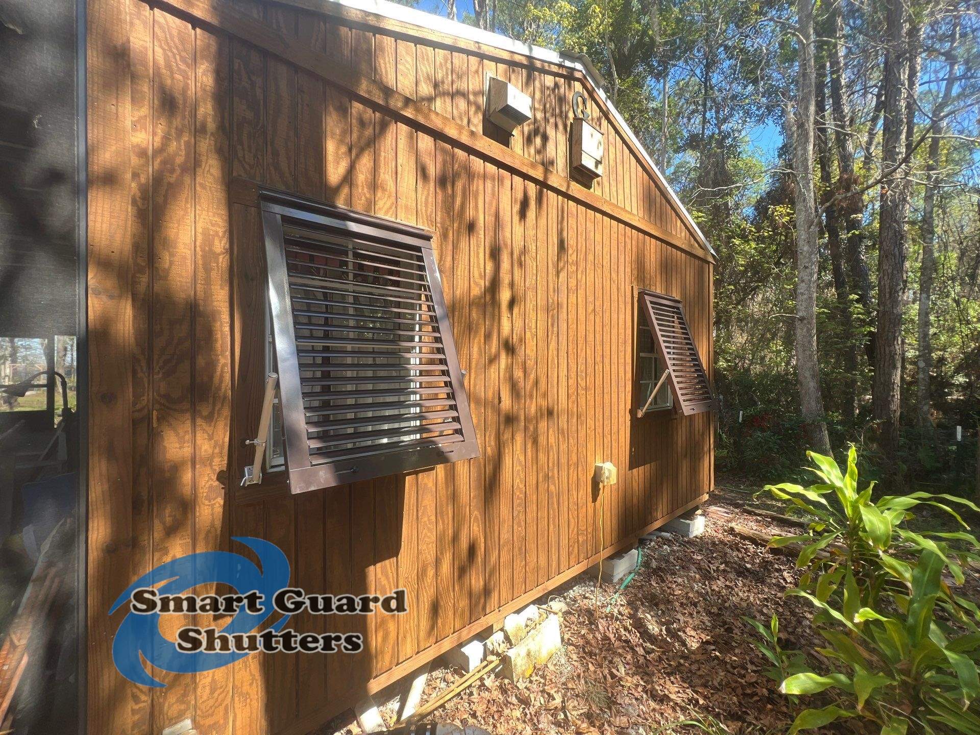 Hurricane Protection in Bronze/Grey Brown by Smart Guard Shutters