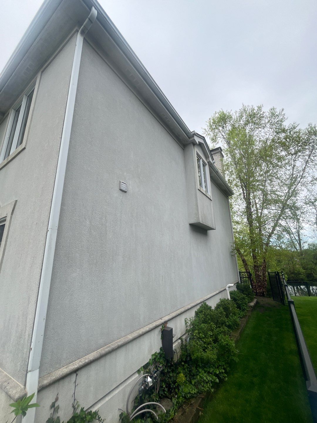 dryvit using Algaecide, soft wash soap by Northern Power Washing LLC.