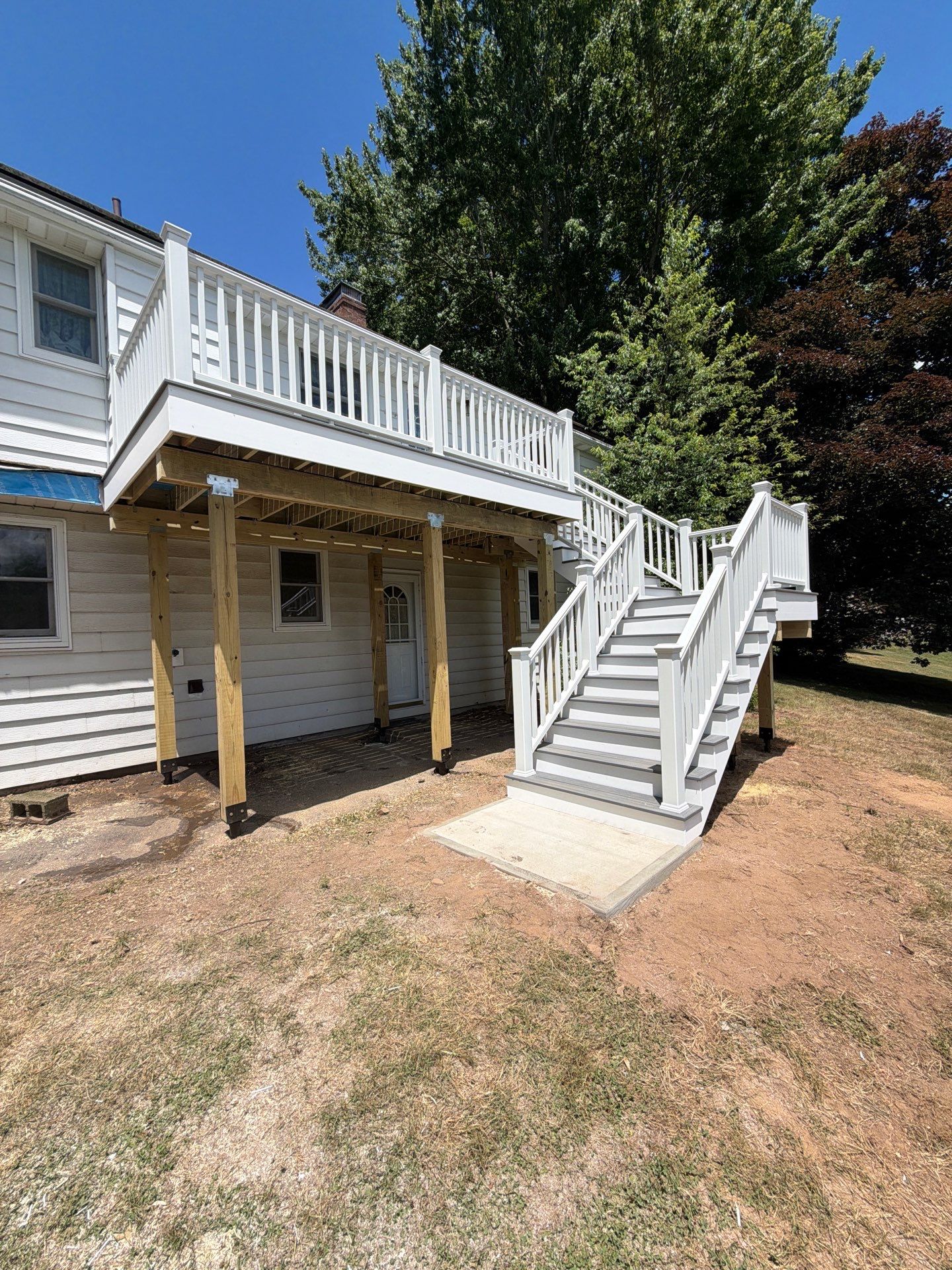 Deck Replacement using Trex tropical Island mist and transcend white railing.  by DiGiorgi Roofing and Siding Inc