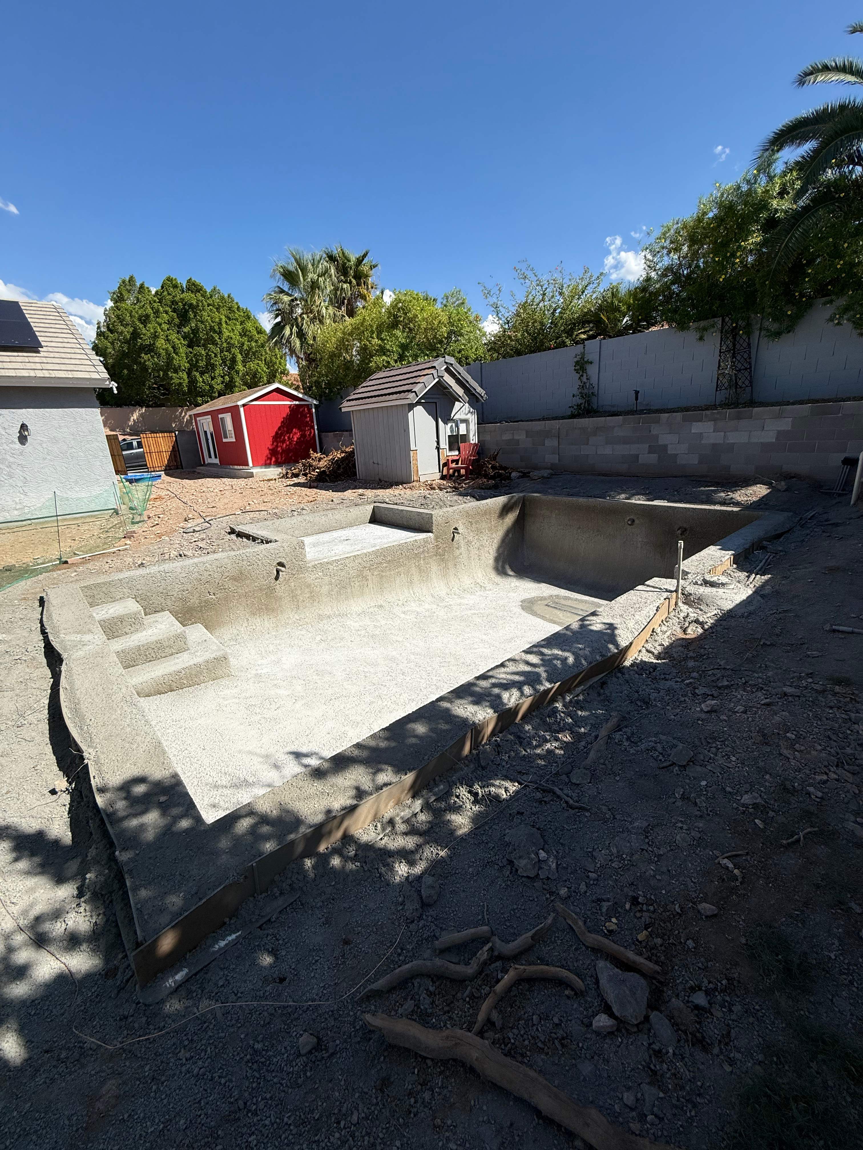 Pool build with baja step and pebble finish by Modern Pools
