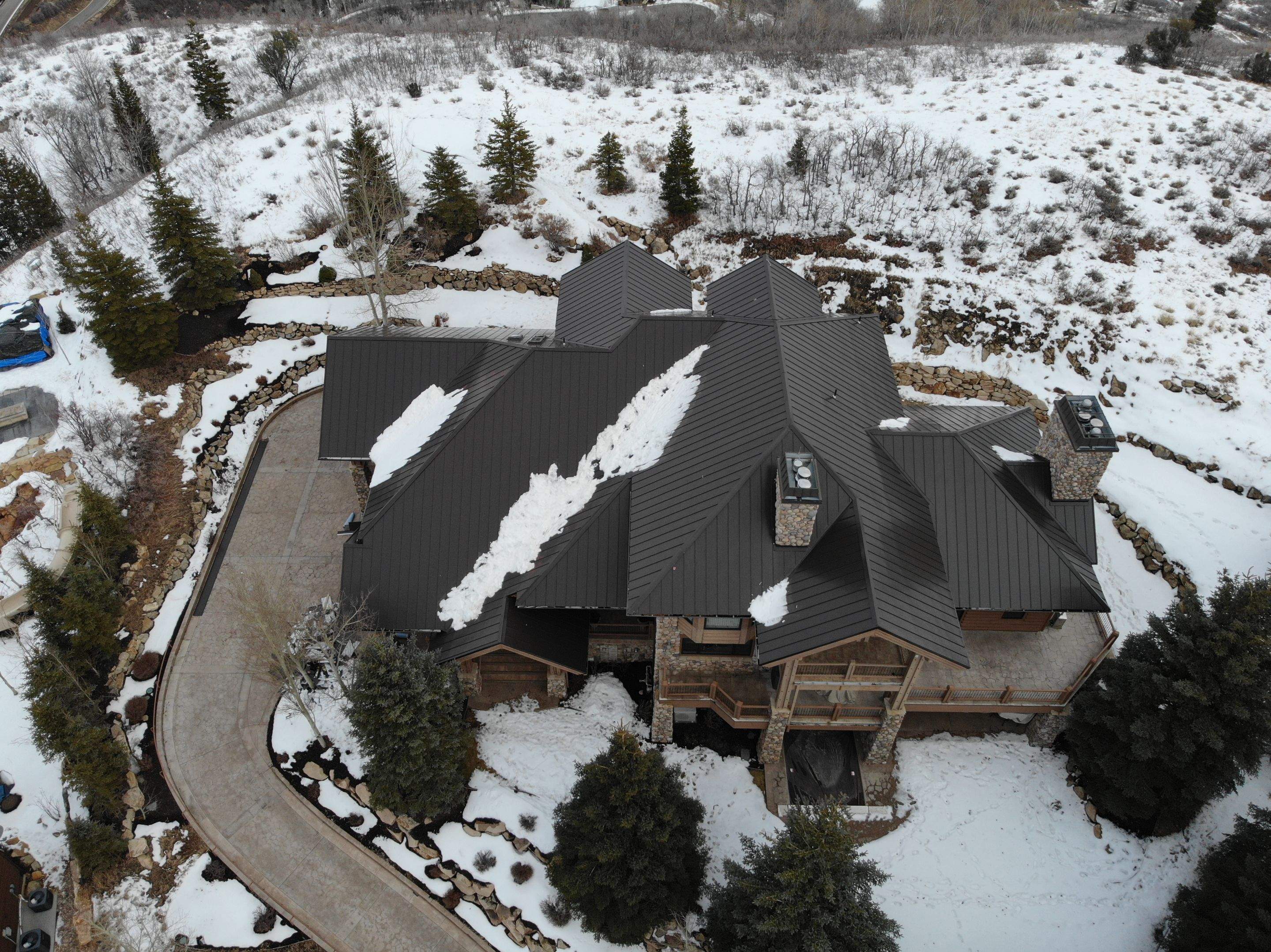 Standing Seam Metal Roof Replacement After Snow Damage by ASAP Roofing & Restoration