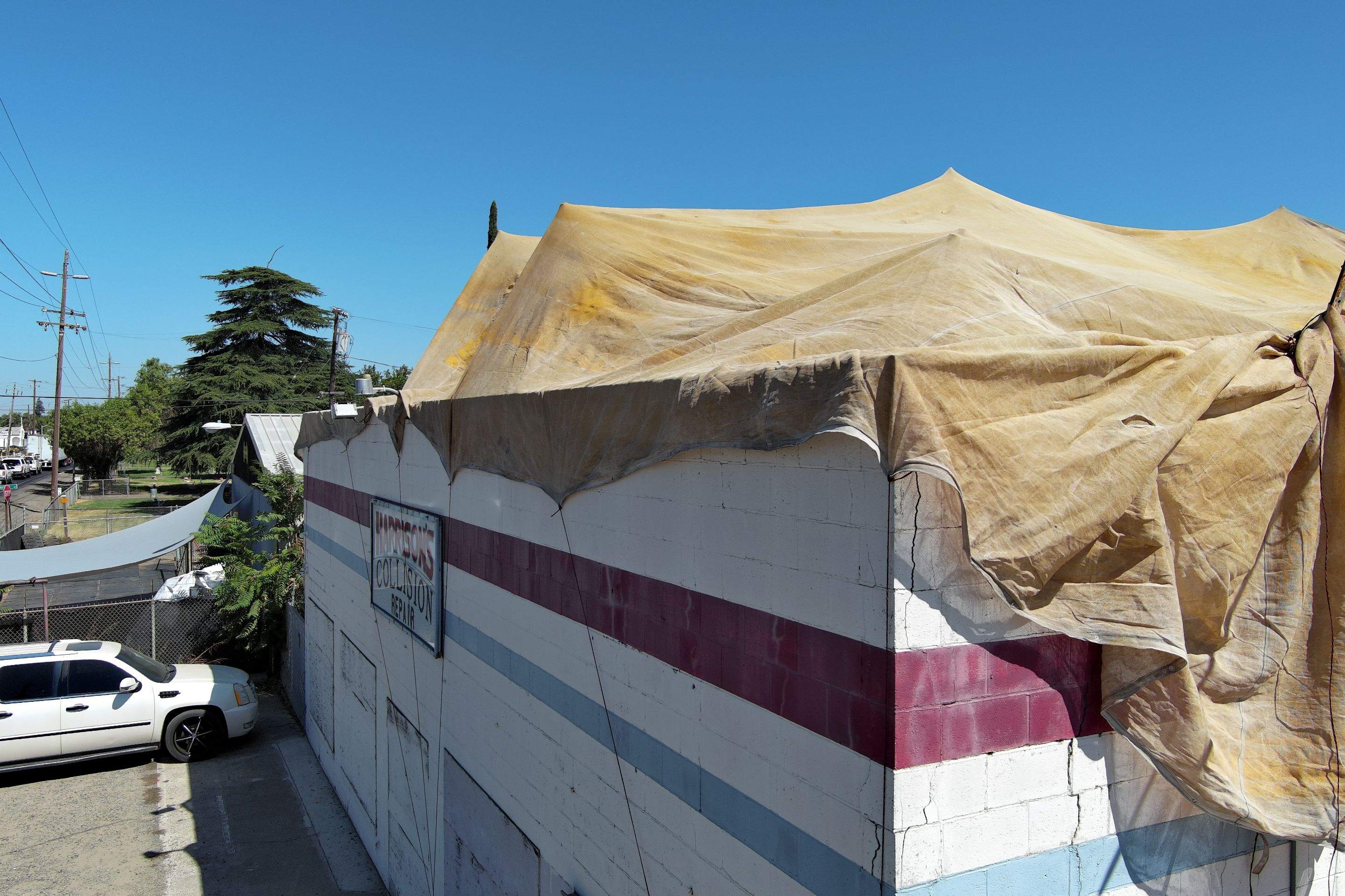 Spray foam and coatings using Conklin Benchmark/ PUMA XL acrylic coatings over metal and foam by Straight Edge Roofing Inc