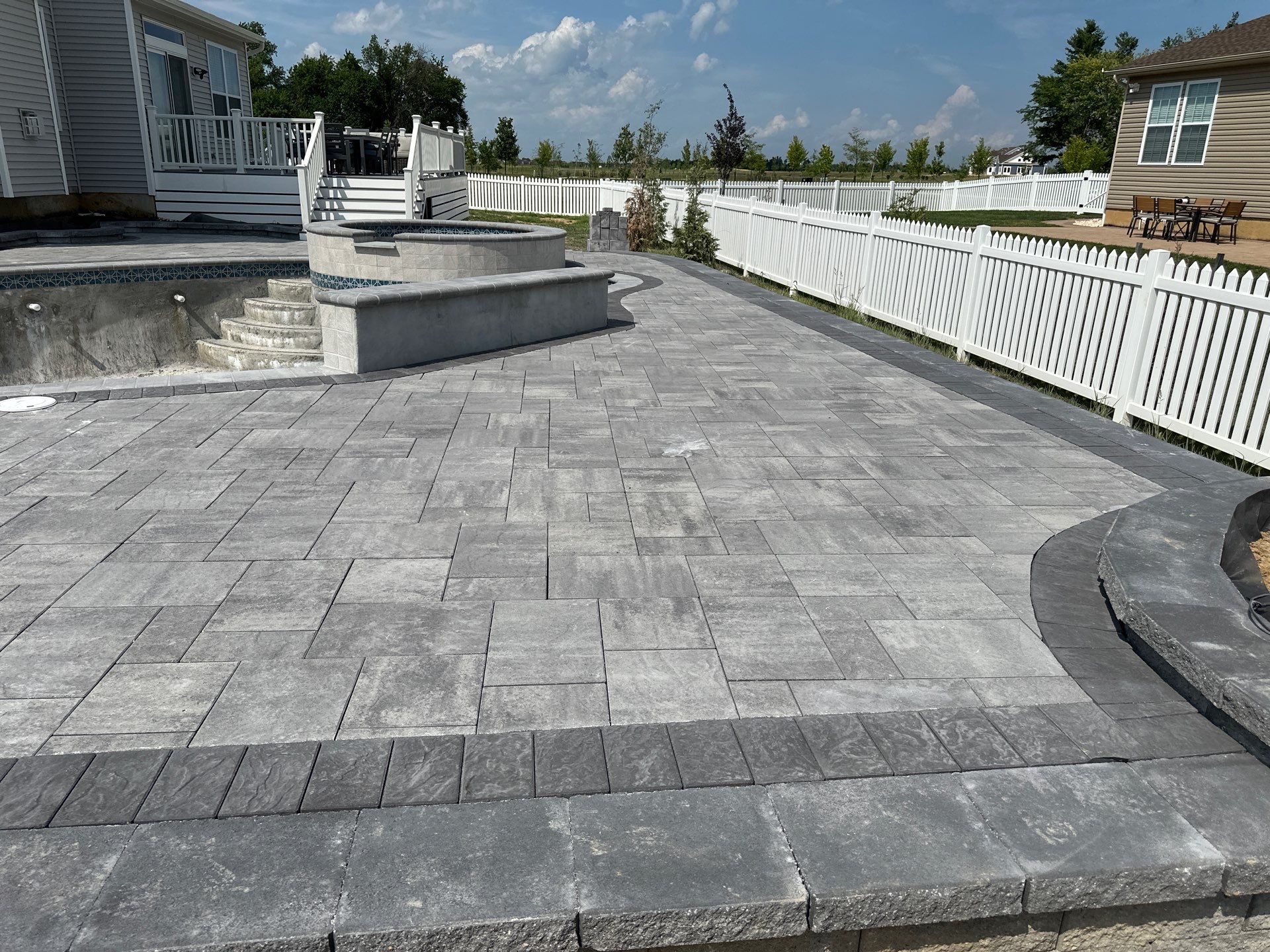 Pool and Hardscape Design in Delaware | Belgard Paver Patio & Outdoor Living Space by Studio G Indoor Spaces & Outdoor Living