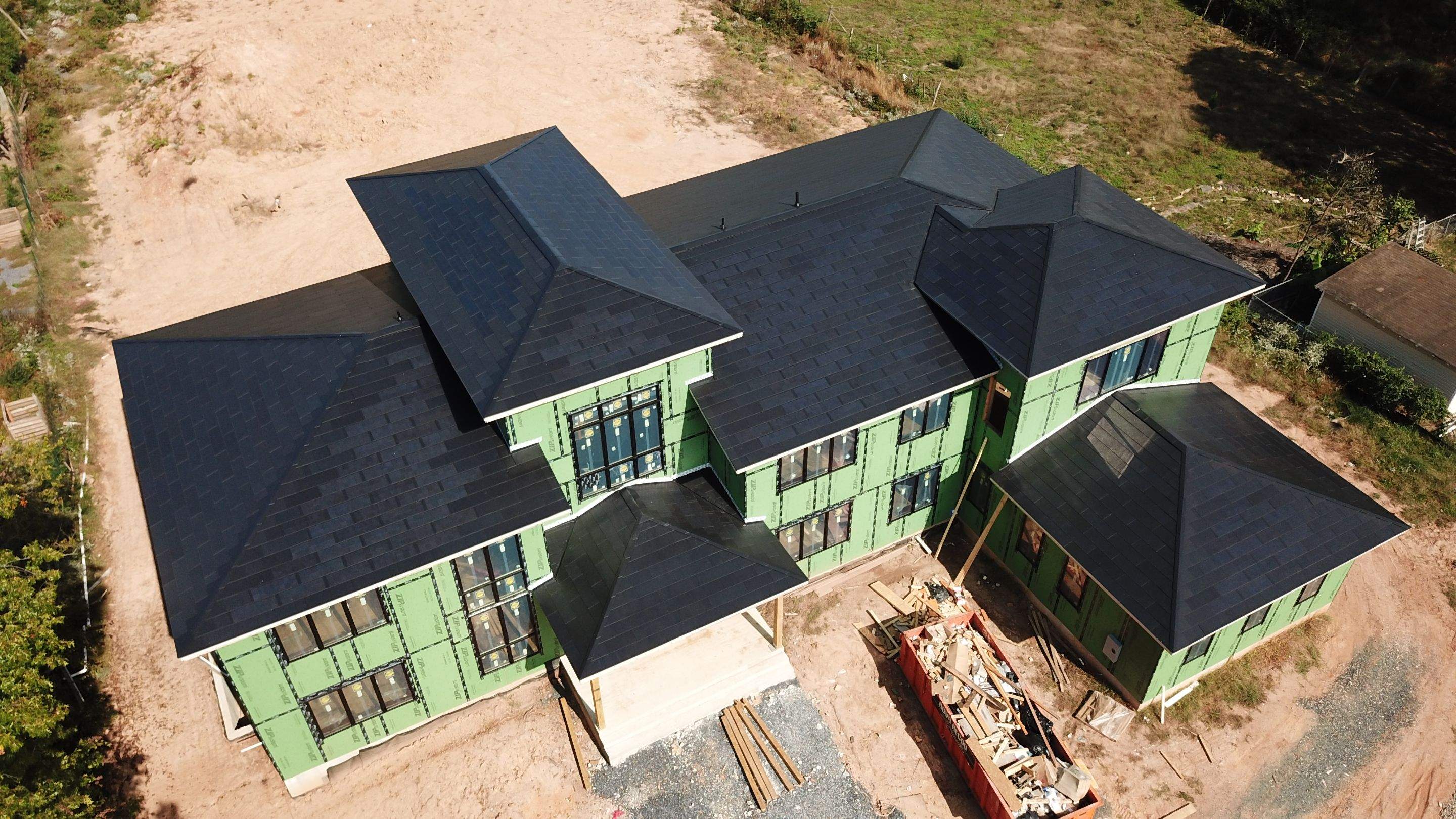 Tesla Solar Roof  using Tesla Solar Roof V3 tiles by American Home Contractors