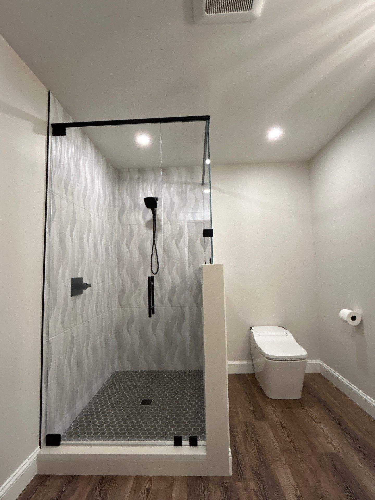 Frameless Shower Enclosure w/Header Bar by Cheshire Glass Company