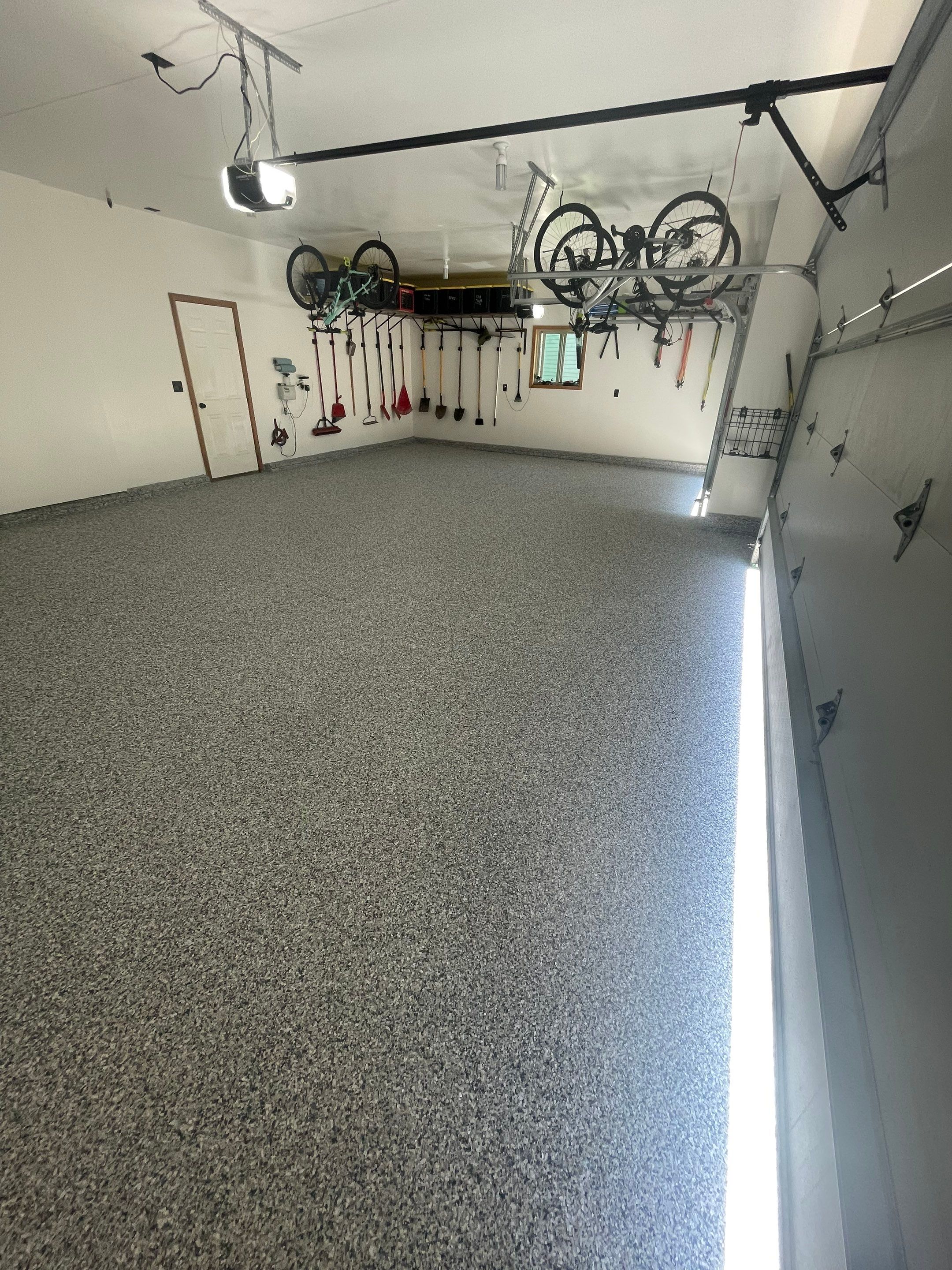 Tidal Wave Flake Garage Floor Installation in Sioux Falls by Select Painting, Coatings & Garage Cabinets