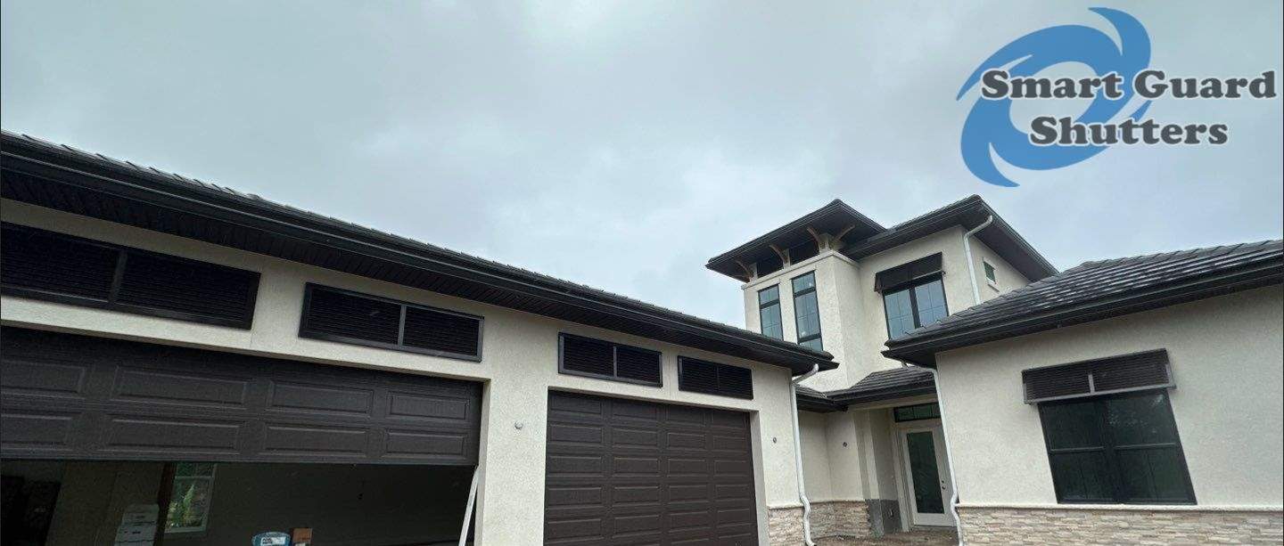 Decorative Bahama Shutters in Grey Brown by Smart Guard Shutters