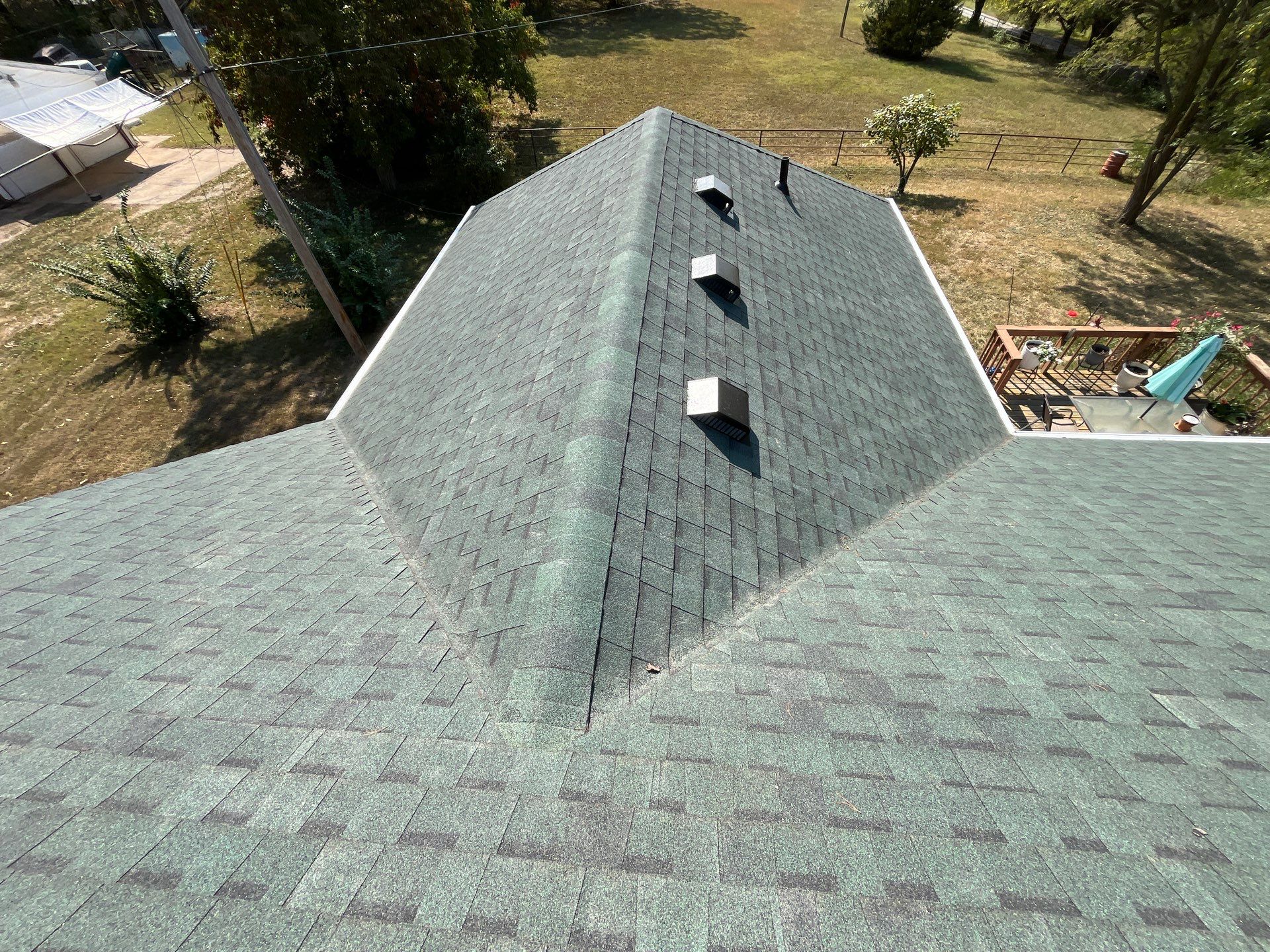 Residential Roofing Install - Green Atlas Pinnacle Pristine Shingles - White Gutters & Downspouts  by Titan Commercial & Residential Roofing 
