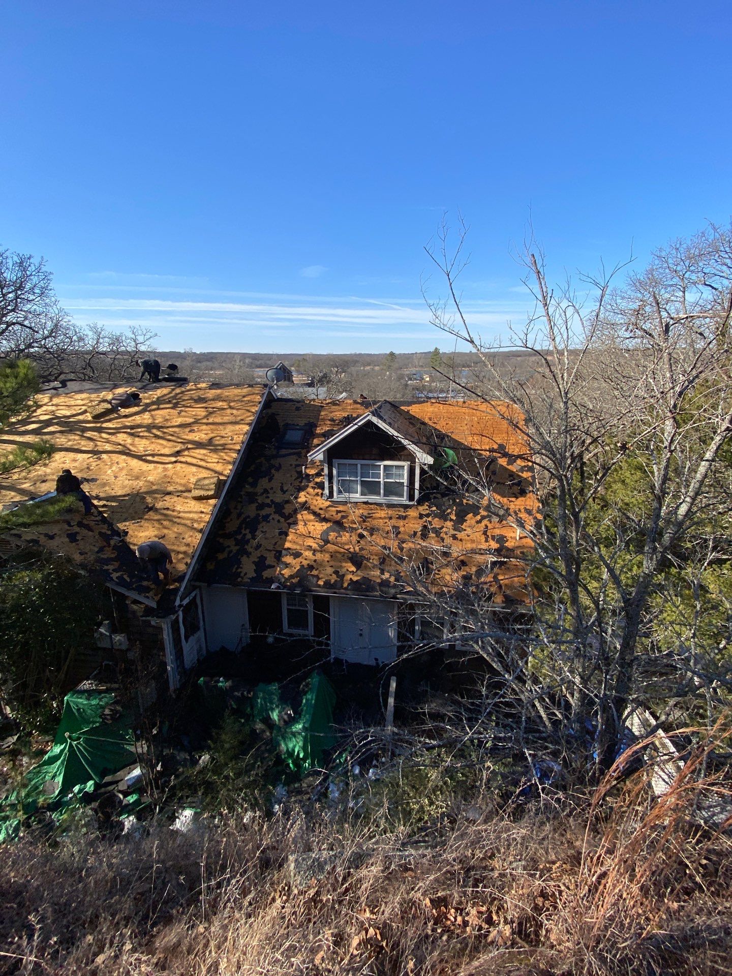 Roof Replacement on a private lake near Ardmore by BANA Roofing and Solar Supply