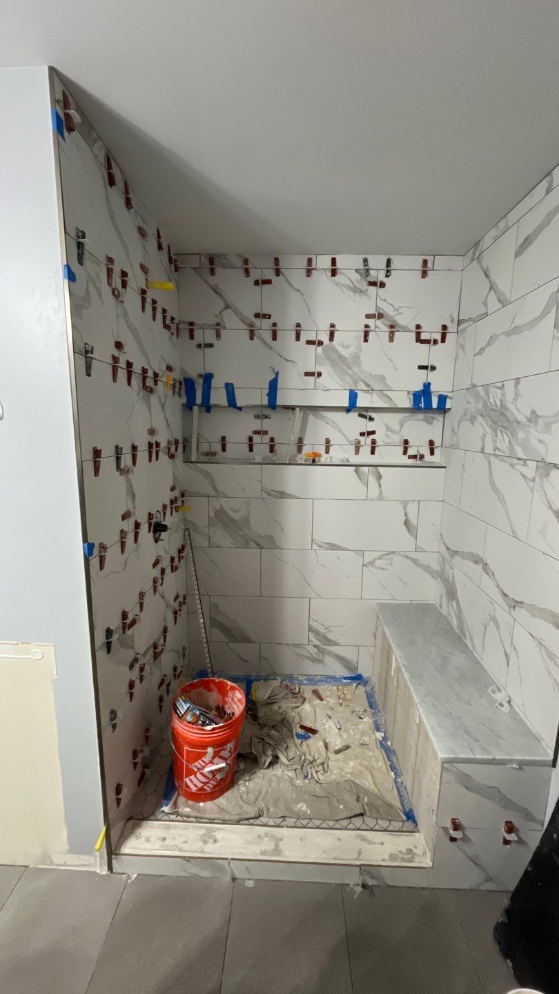 Tub to walk-in shower conversion, and tile flooring by Prudencio