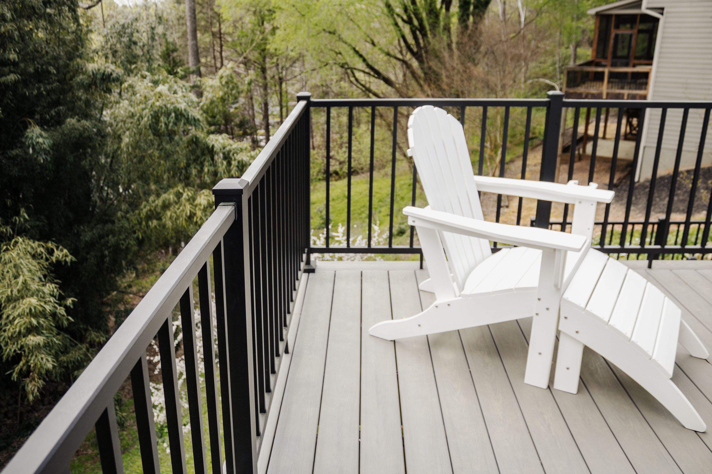 Covered Porch and Deck Build using Deckorators Venture Series Decking and Trex Select Aluminum Railing by Nelson Exteriors