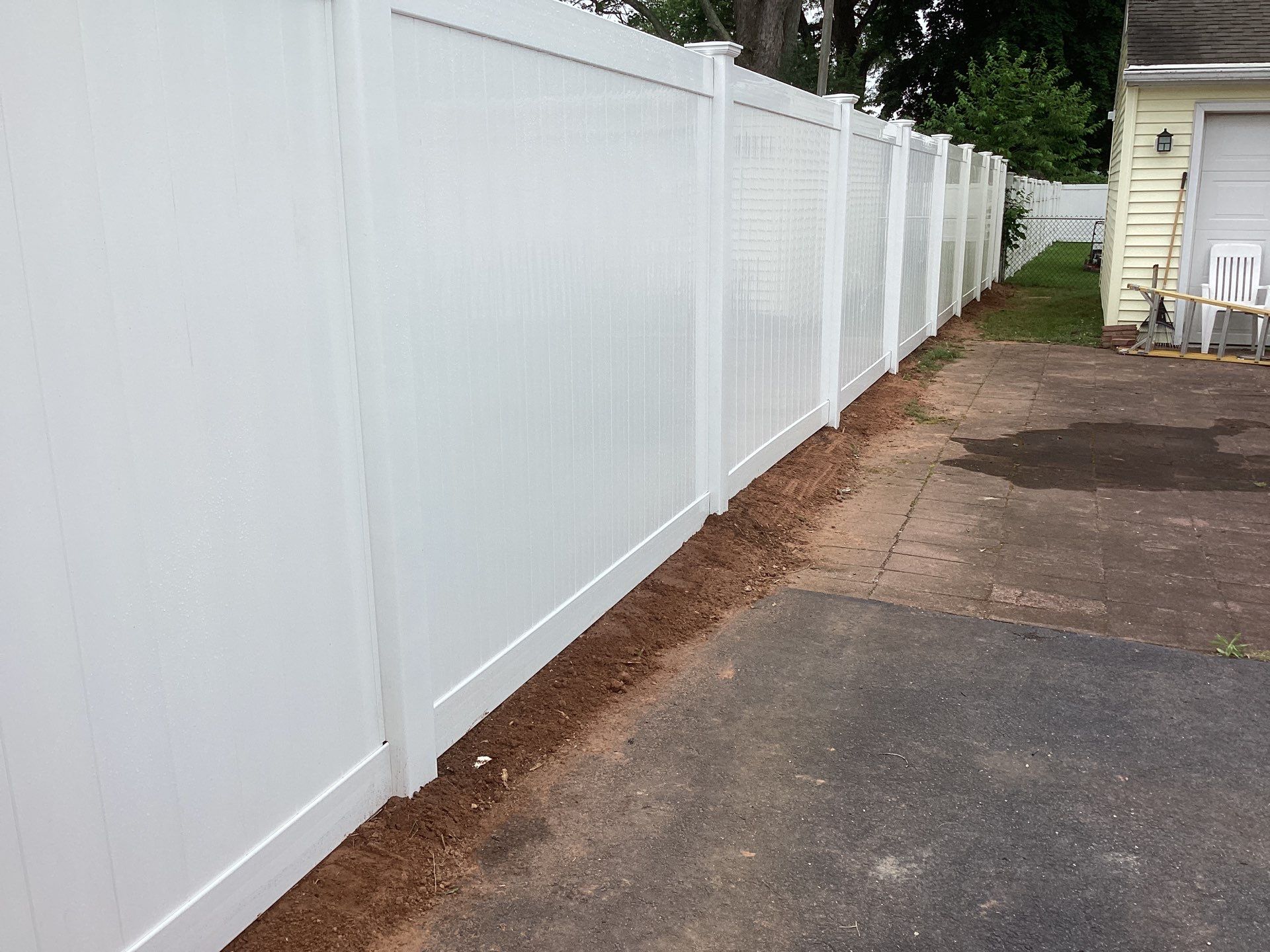 Replacement White Vinyl privacy Fence by DiGiorgi Roofing and Siding Inc