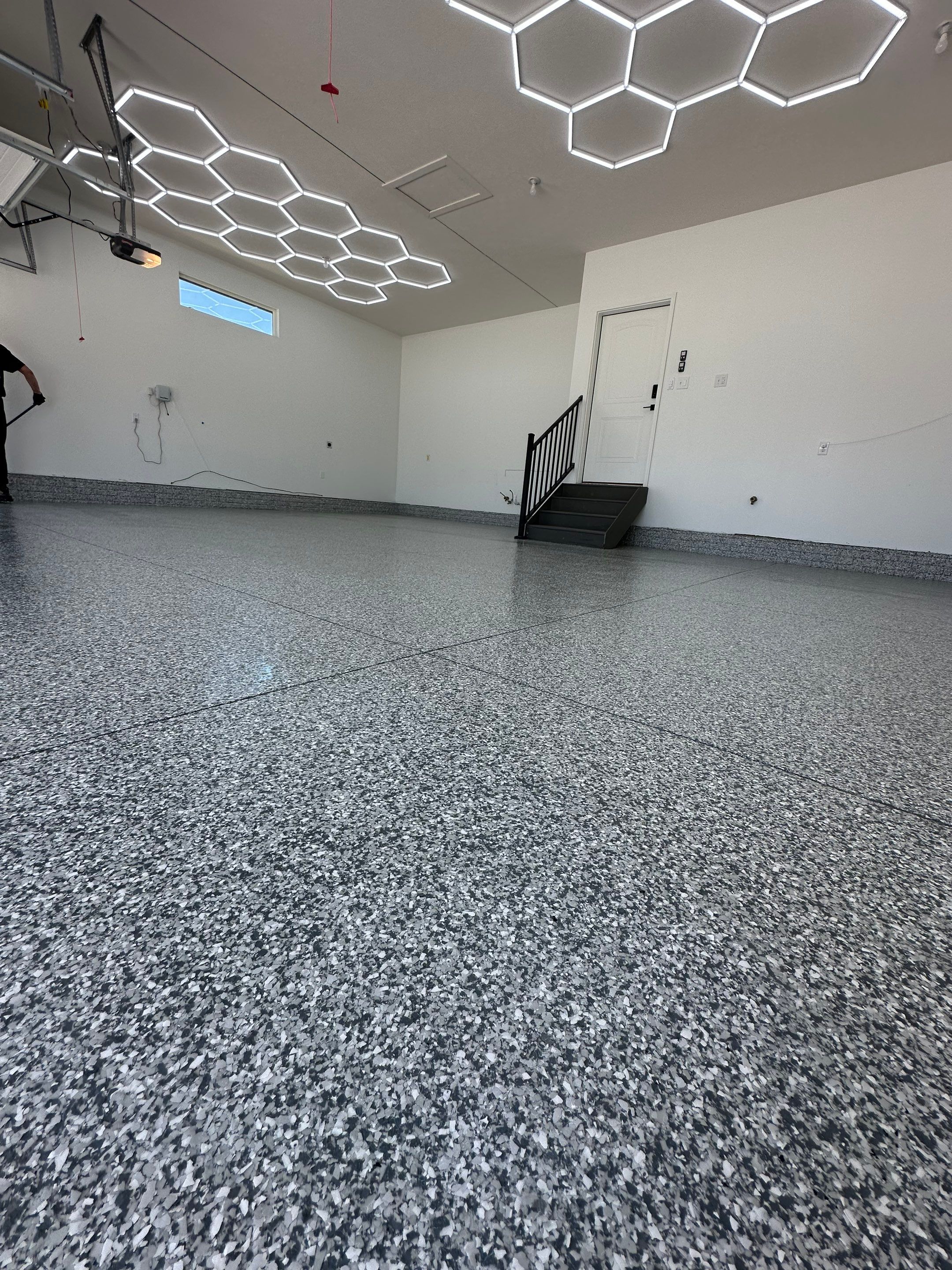 Three-Stall Garage Epoxy Floor Coating and LED Lighting in Lincoln by Goat Coatings