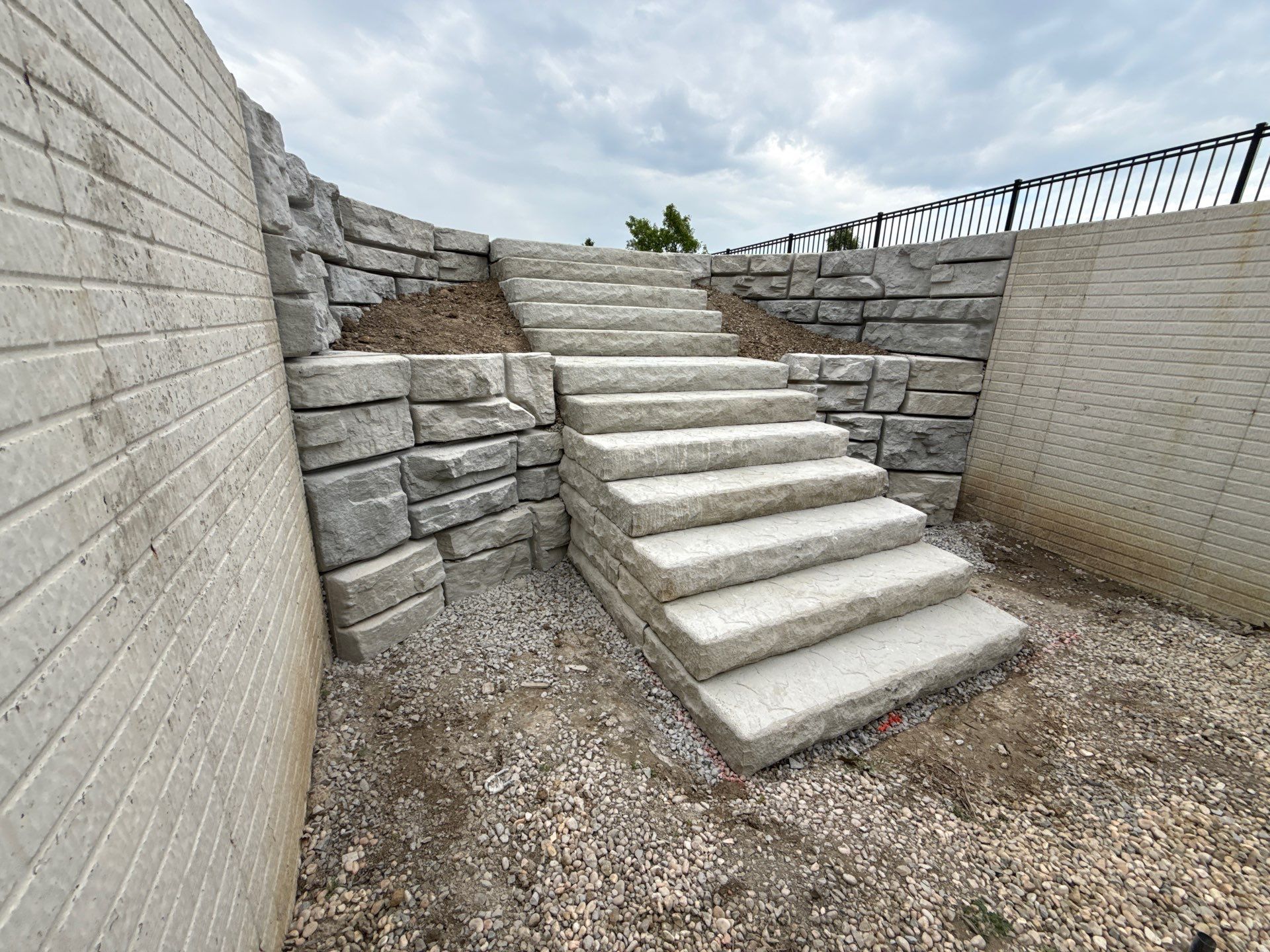 Basement Walkout Construction with Tiered Retaining Walls in Berkey by Farrell's Lawn & Garden Center LLC