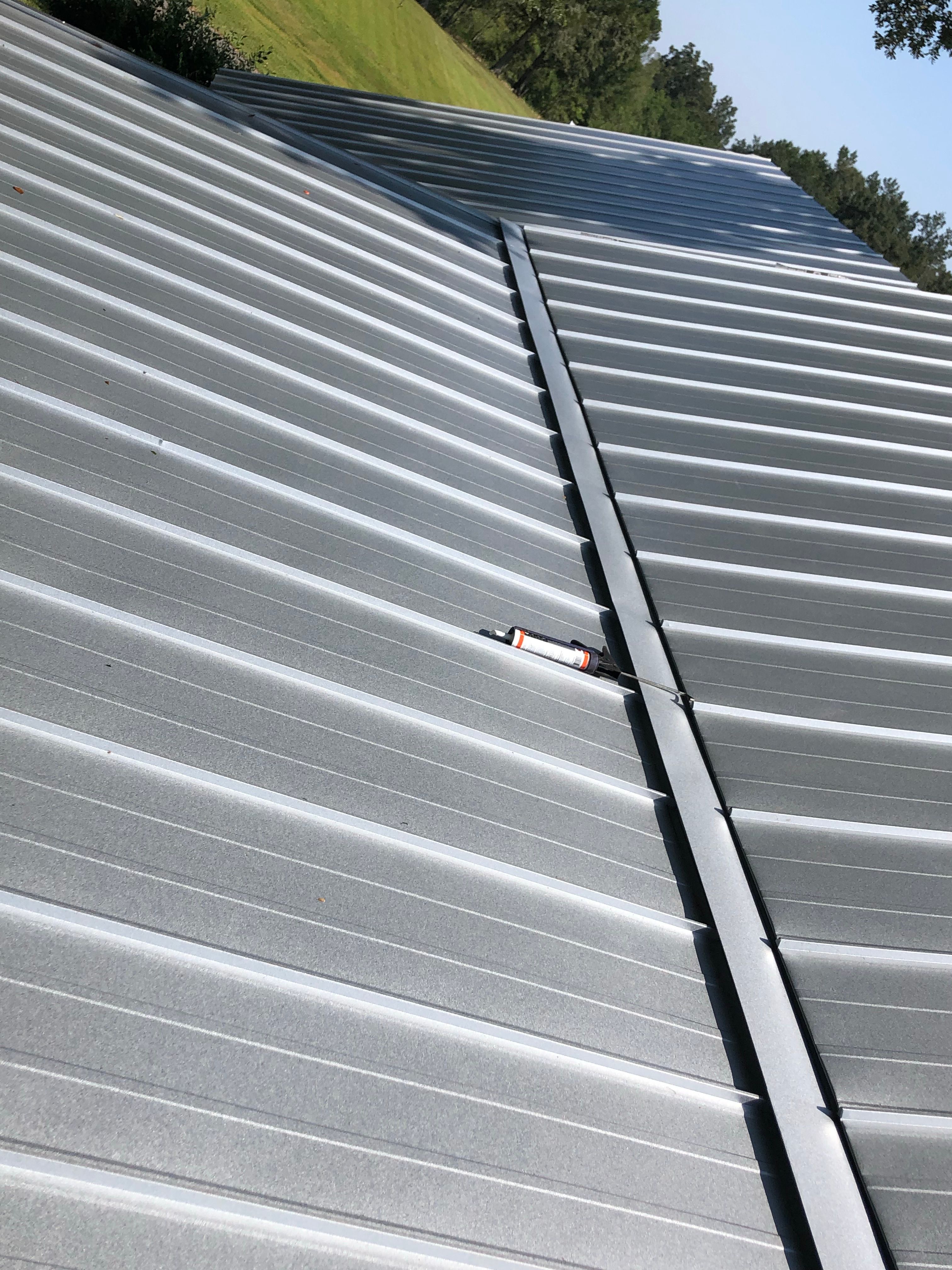Residential Roofing Installation using Metal roofing by American Roofing & Construction LLC