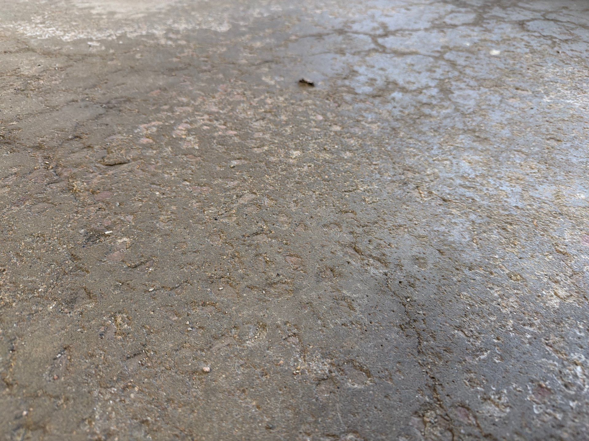 Feather Grey Garage Floor Coating Installation in Sioux Falls by Select Painting, Coatings & Garage Cabinets