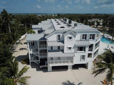 Pac-Clad 040 Aluminum Standing Seam metal roof and GAF hot mopped Modified with tapered Iso insulation