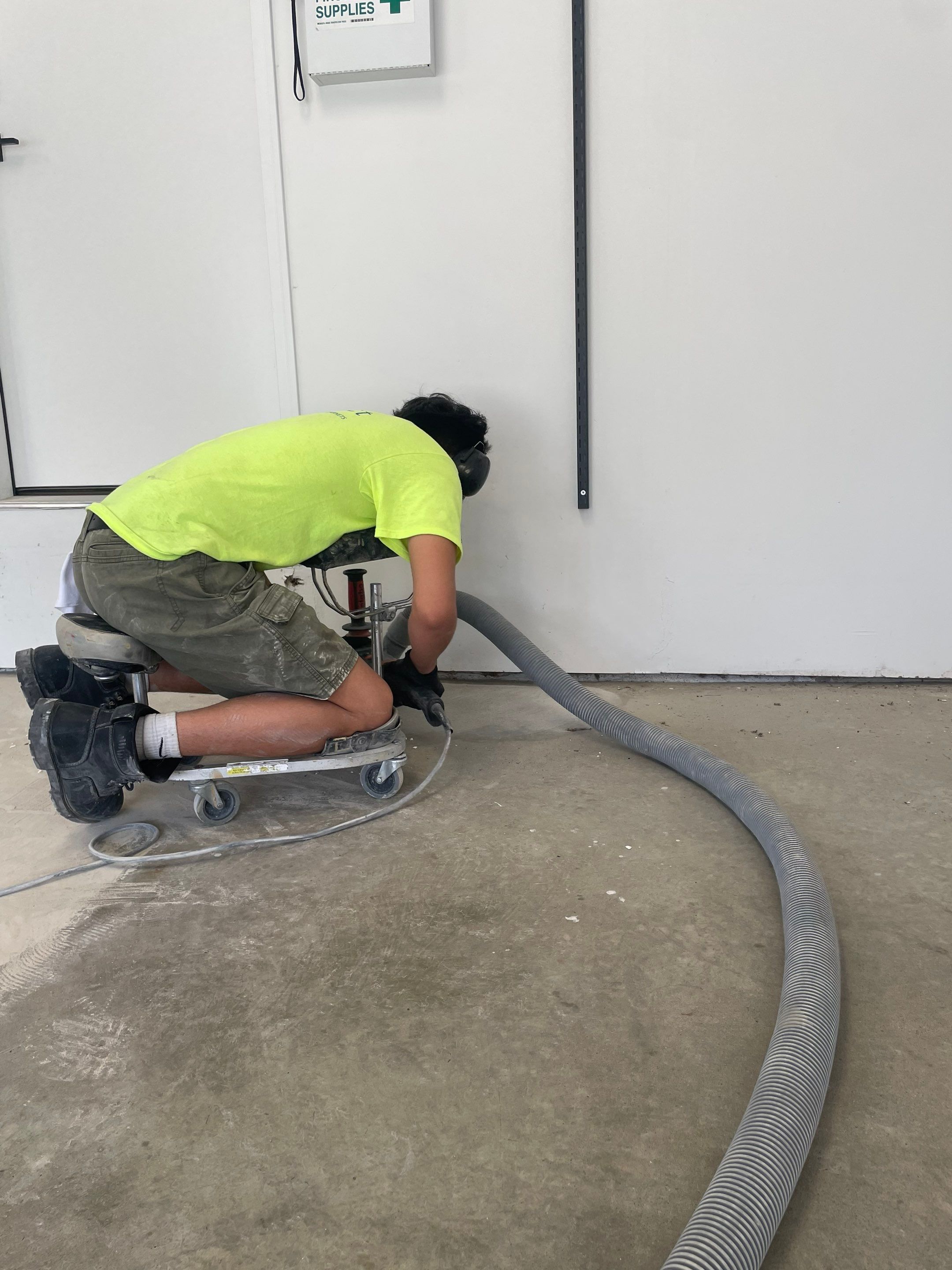 Feather Grey Garage Floor Coating Installation in Sioux Falls by Select Painting, Coatings & Garage Cabinets