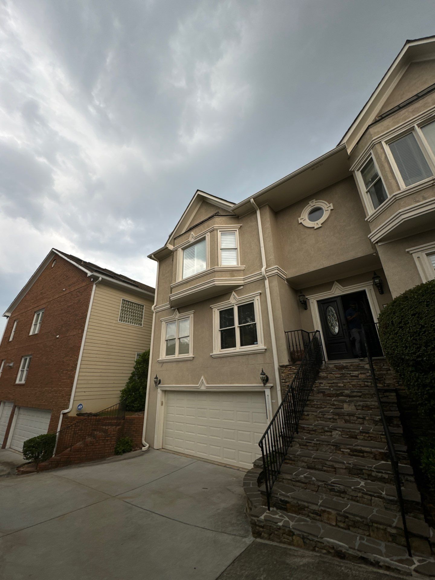 Full Exterior Stucco Painting and Wood Deck Staining in Atlanta by Swift Home Renovations