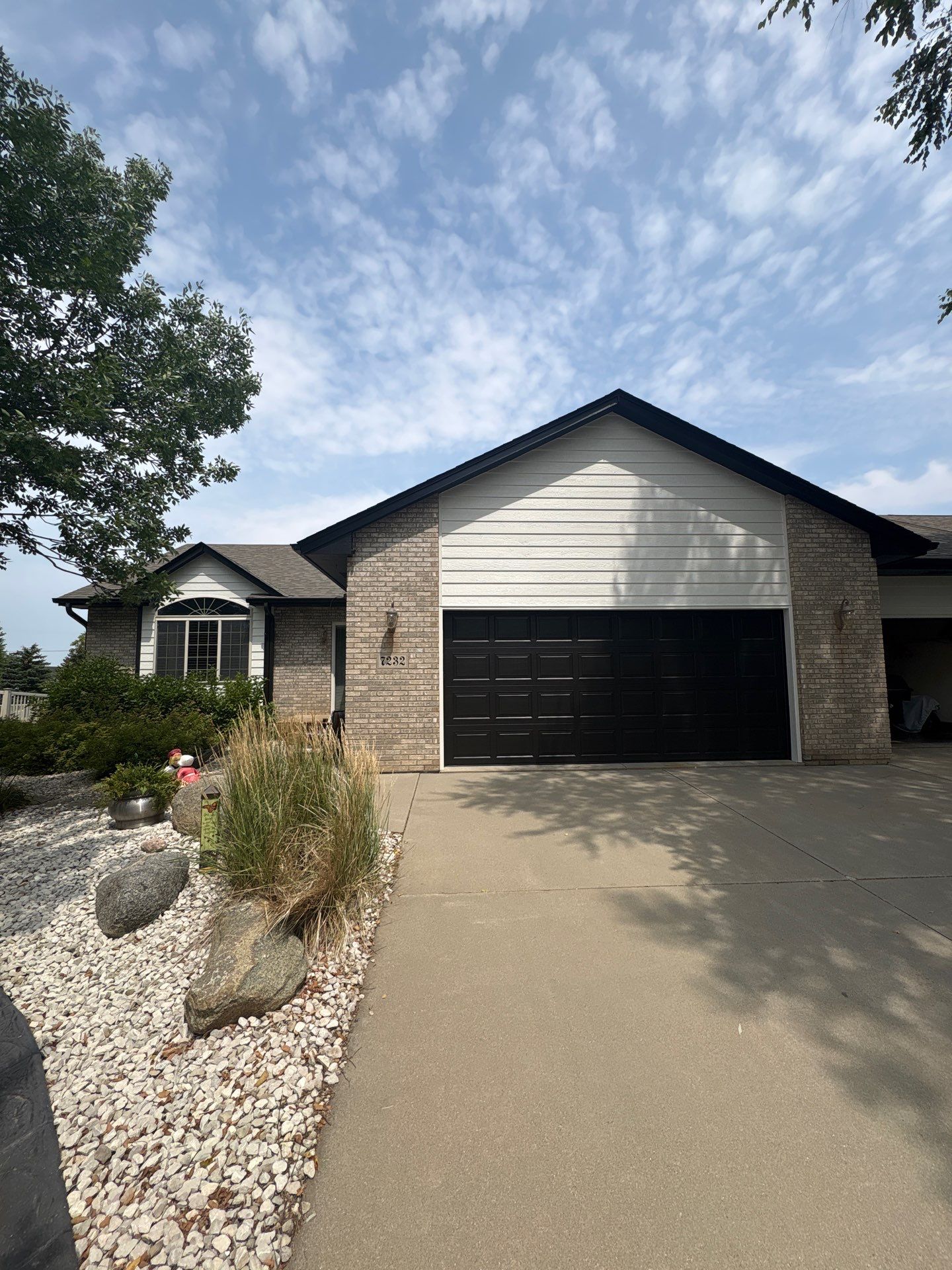 Residential Exterior Painting and Siding Refresh in Sioux Falls by Select Painting, Coatings & Garage Cabinets