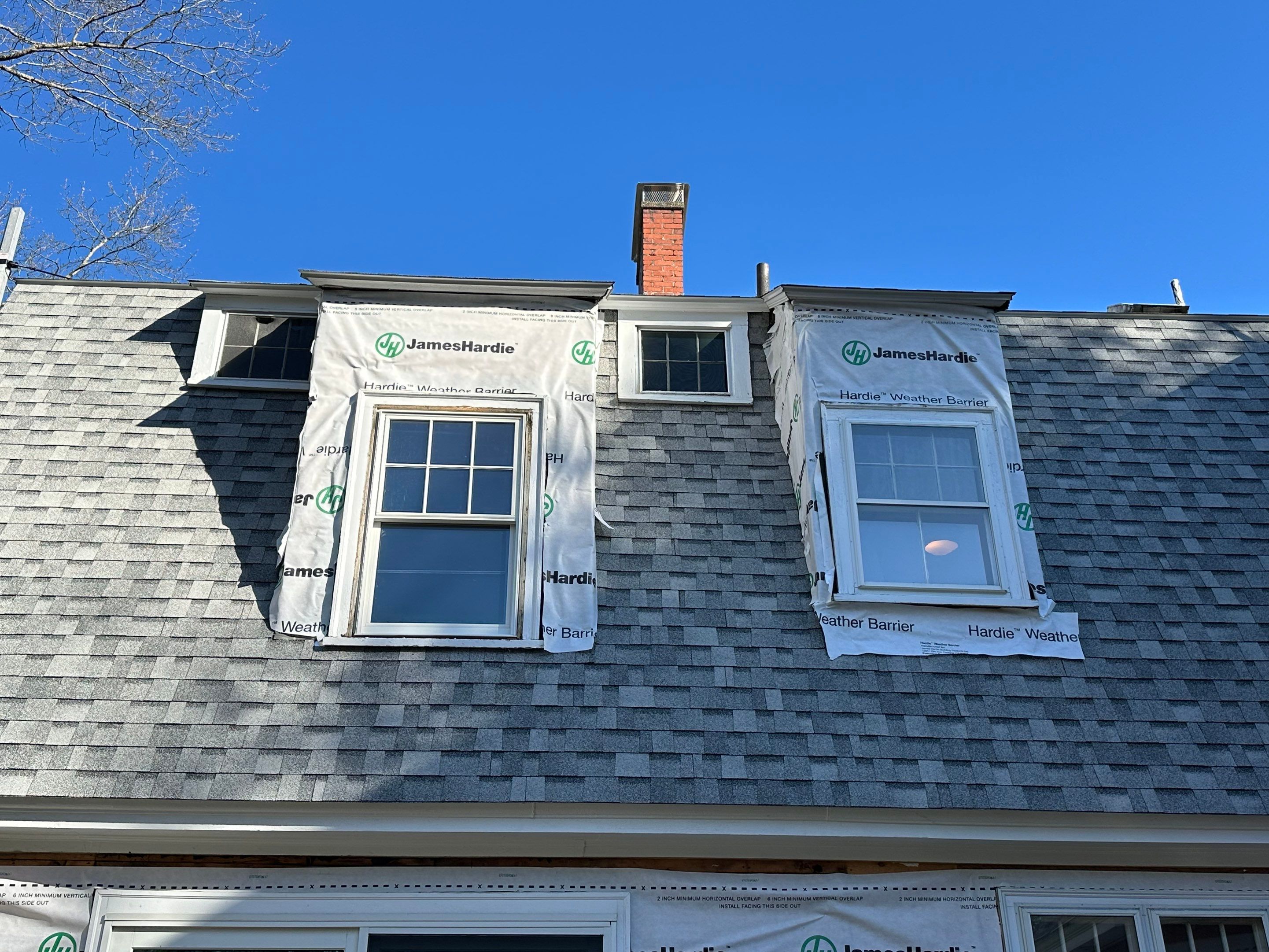 White cedar shingles and windows in Wayland, MA by UBrothers Construction