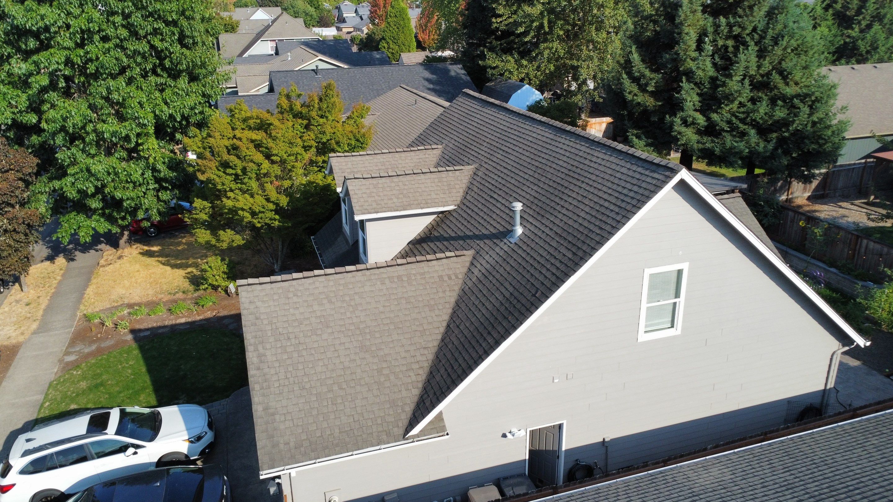 Granite Black Residential Roof Replacement by Orezona Building & Roofing Company, Inc.